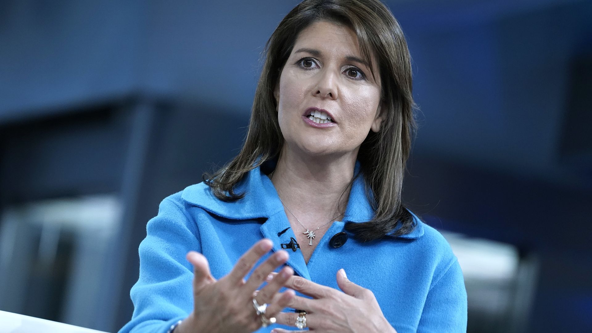 In this image, Nikki Haley sits