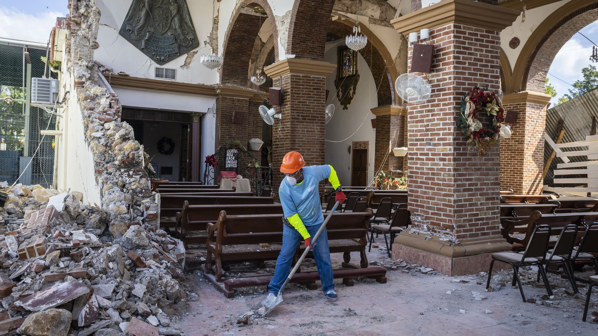 Workers clean the debris from the Immaculate Conception Church after 6.4-magnitude earthquake hit Guayanilla, Puerto Rico on January 11