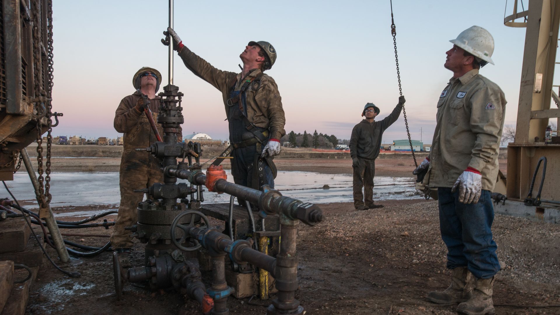 Three oil workers at a fracking site in North Dakota