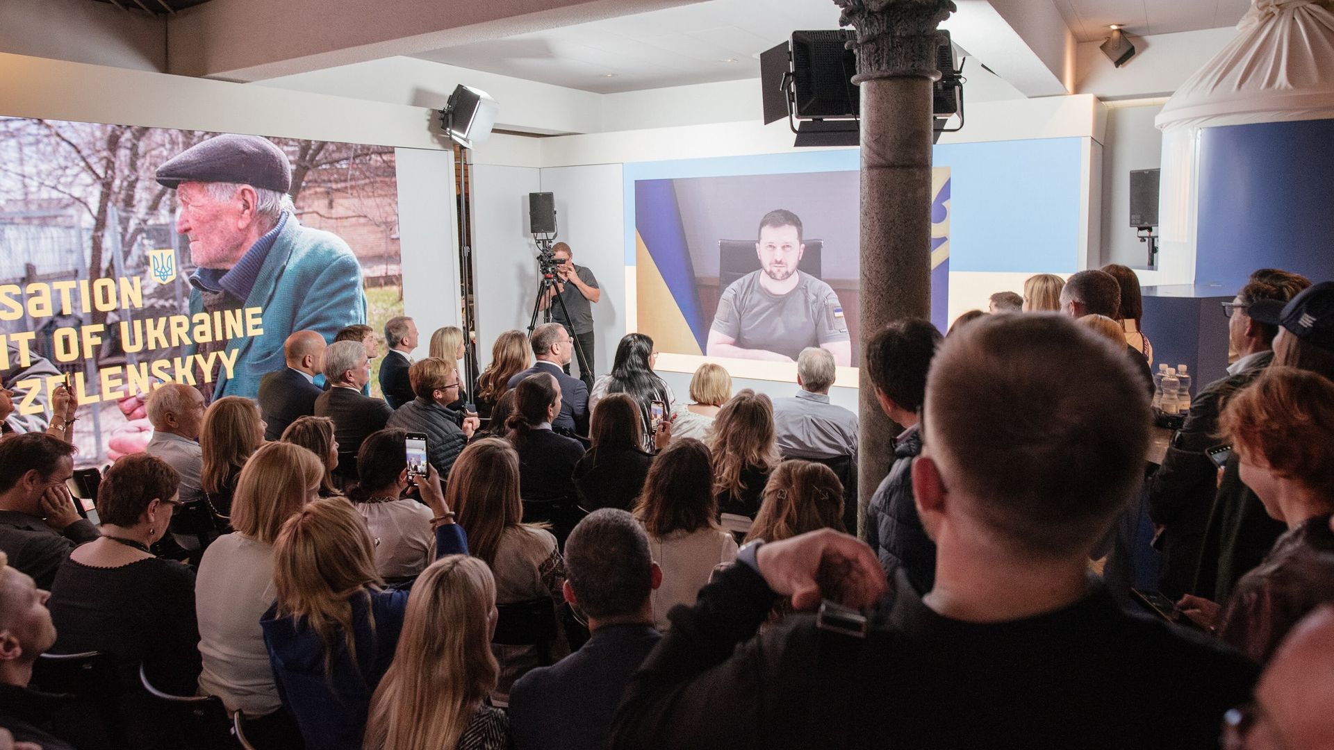 Volodymyr Zelensky speaks on a screen in Davos