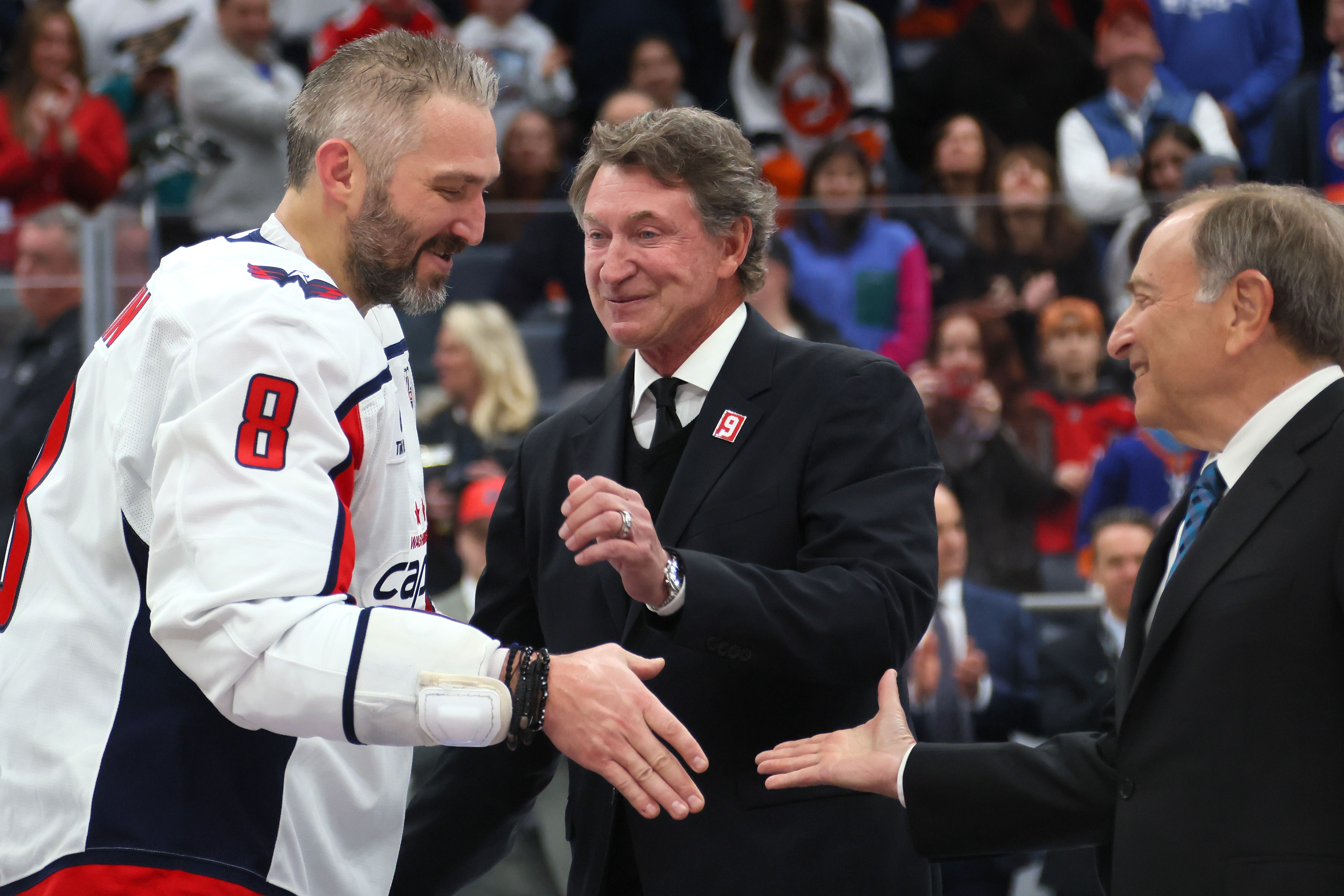 Alex Ovechkin shakes hands with NHL Commissioner and Wayne Gretzky after game