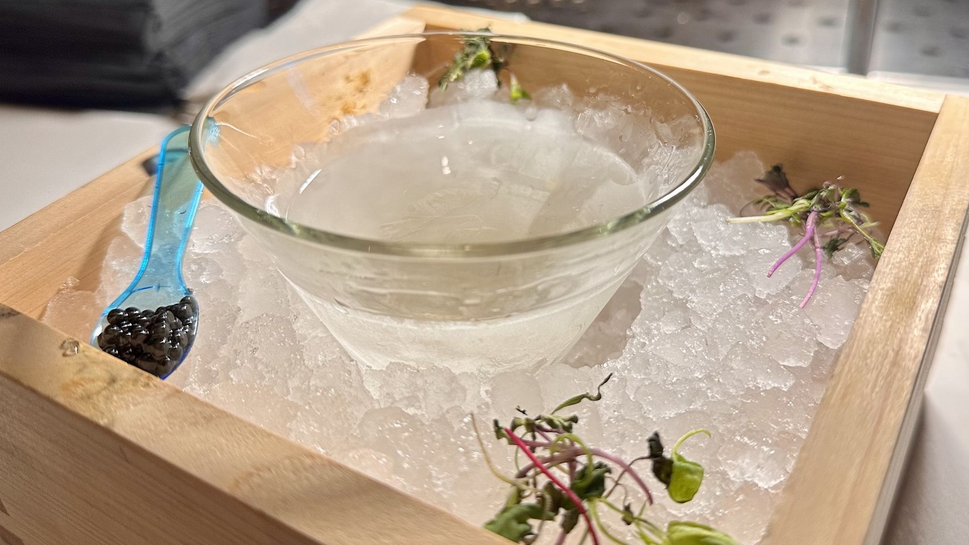 A close-up photo of a martini in a box of ice