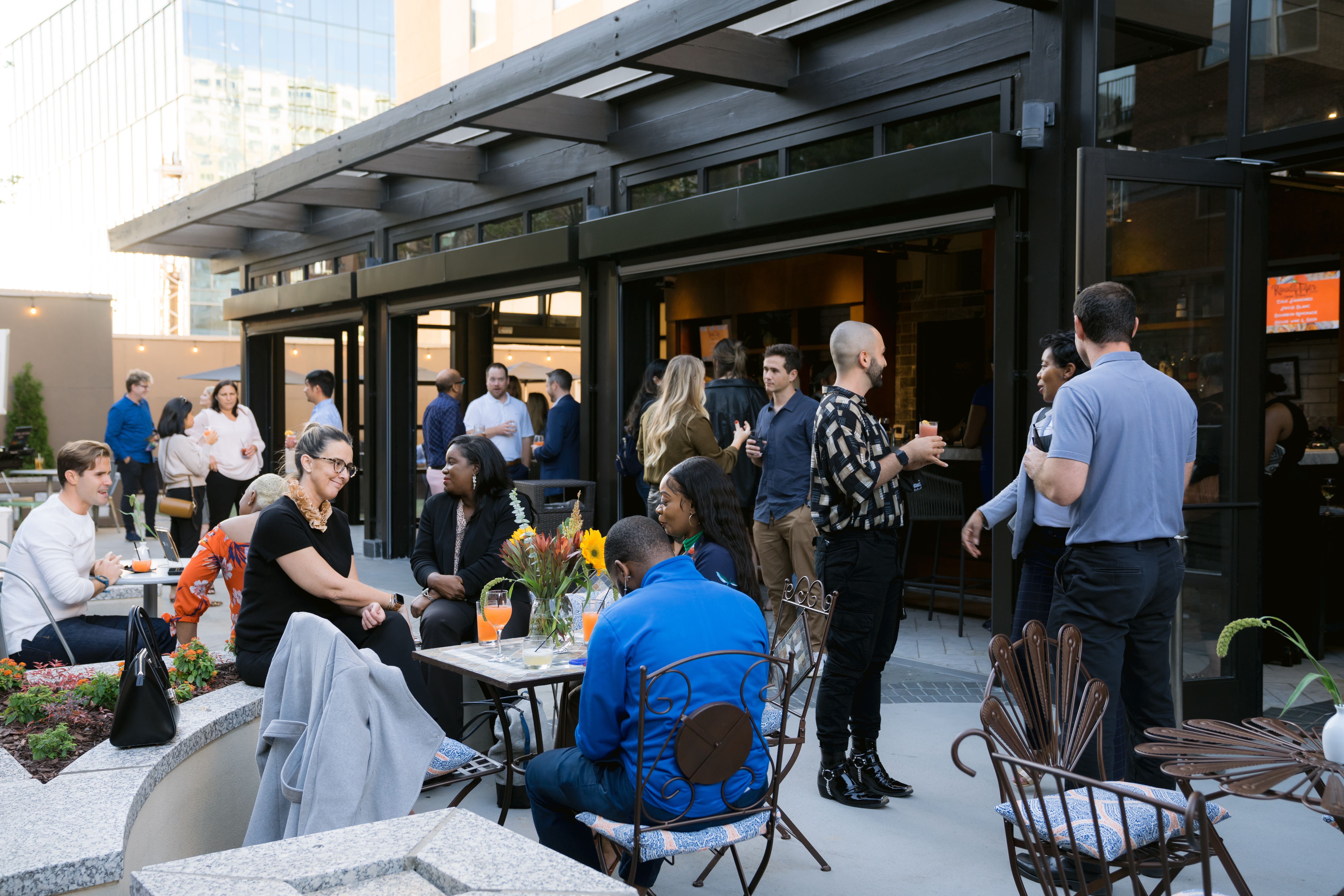 People gather on a rooftop bar