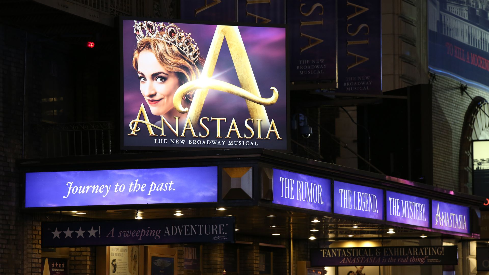 Photo of a screen display advertising "Anastasia" the musical in front of a box office theater