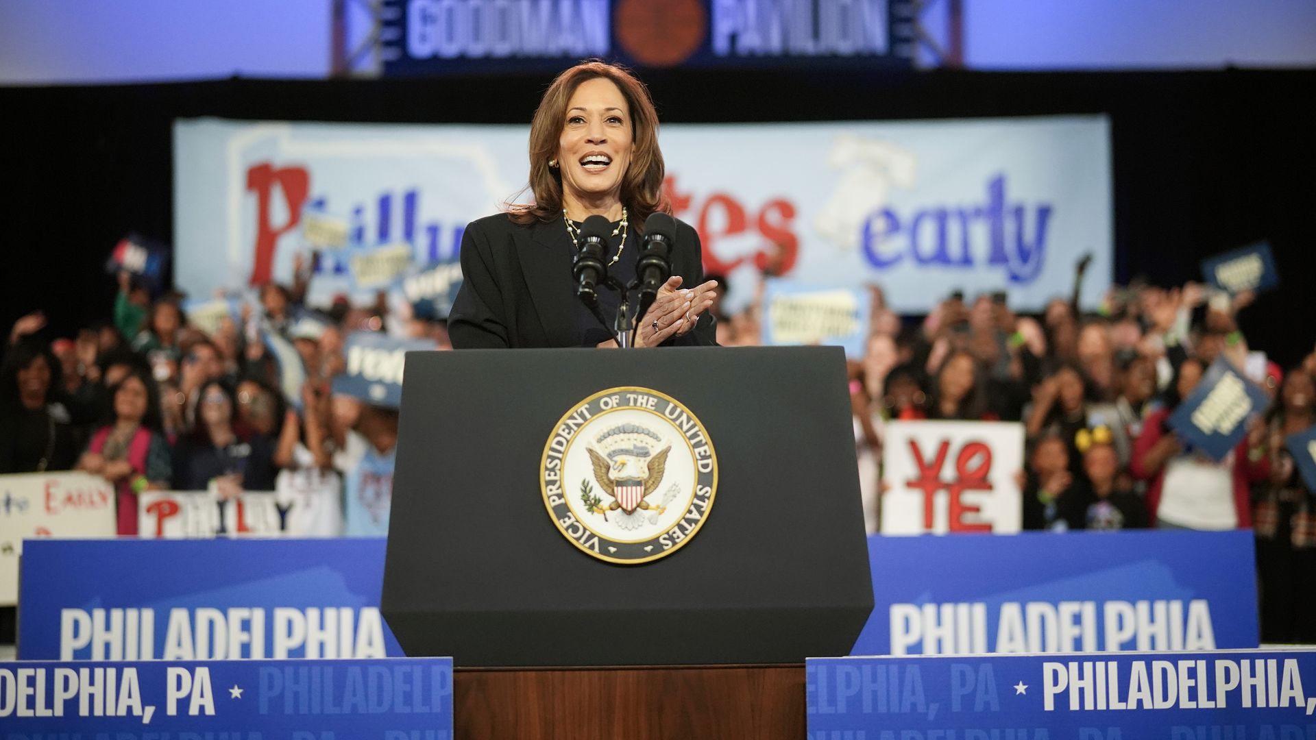 A photo of Vice President Kamala Harris speaking behind a podium.