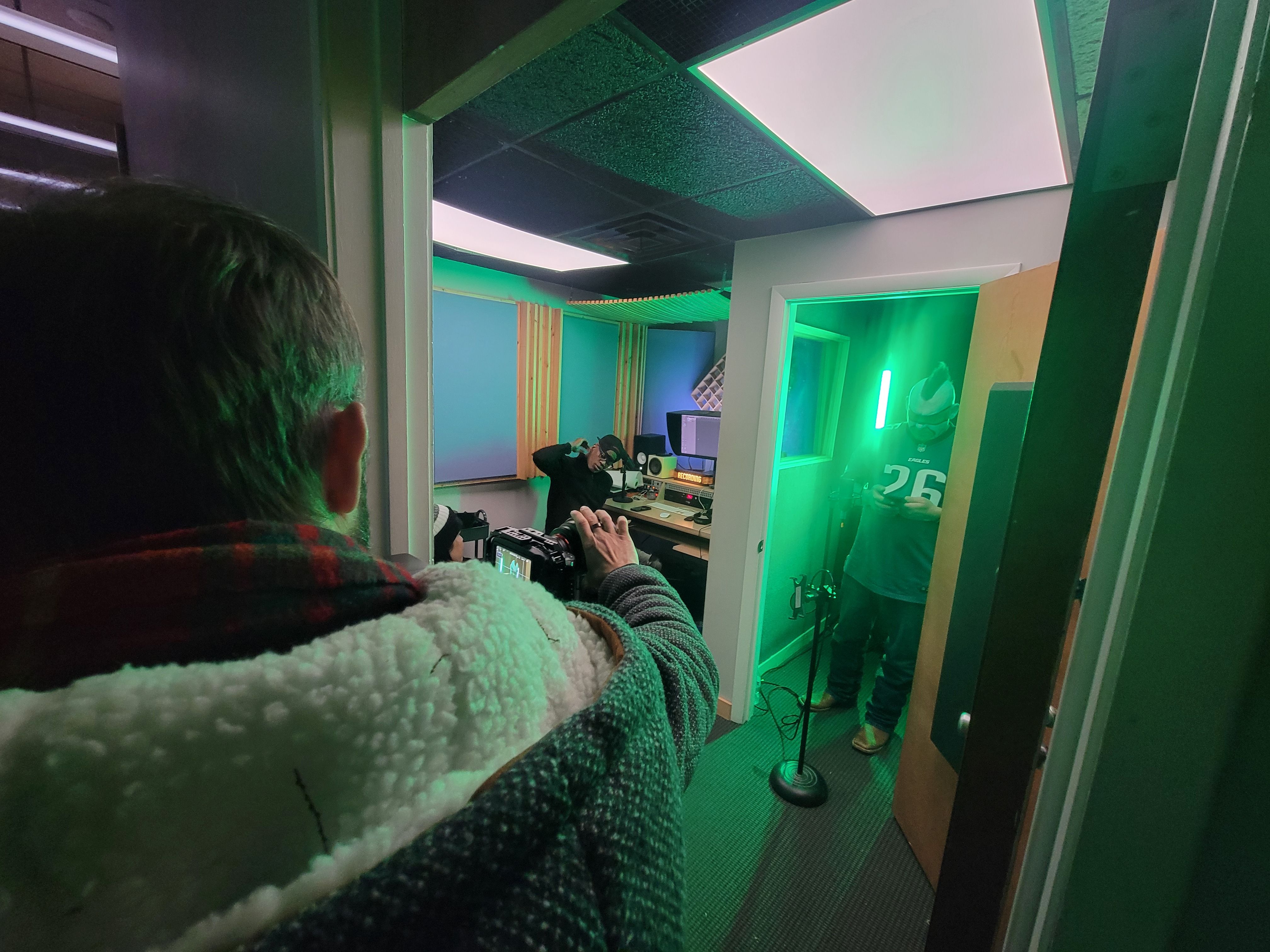 King Creative owner Chris Bruce with a camera getting ready to film the Philly Sports Guy's speech.