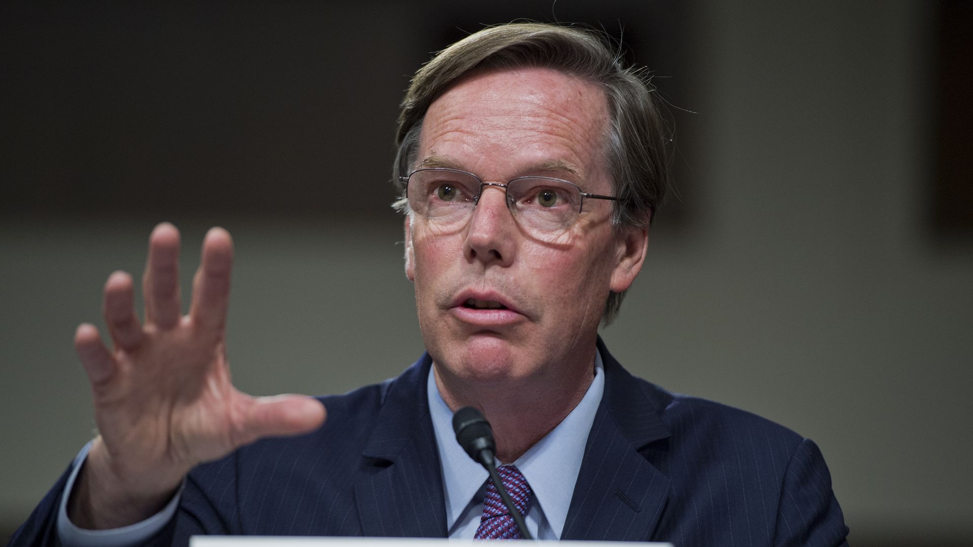 Harvard professor Nicholas Burns motions with his right hand as he testifies to senators in 2015