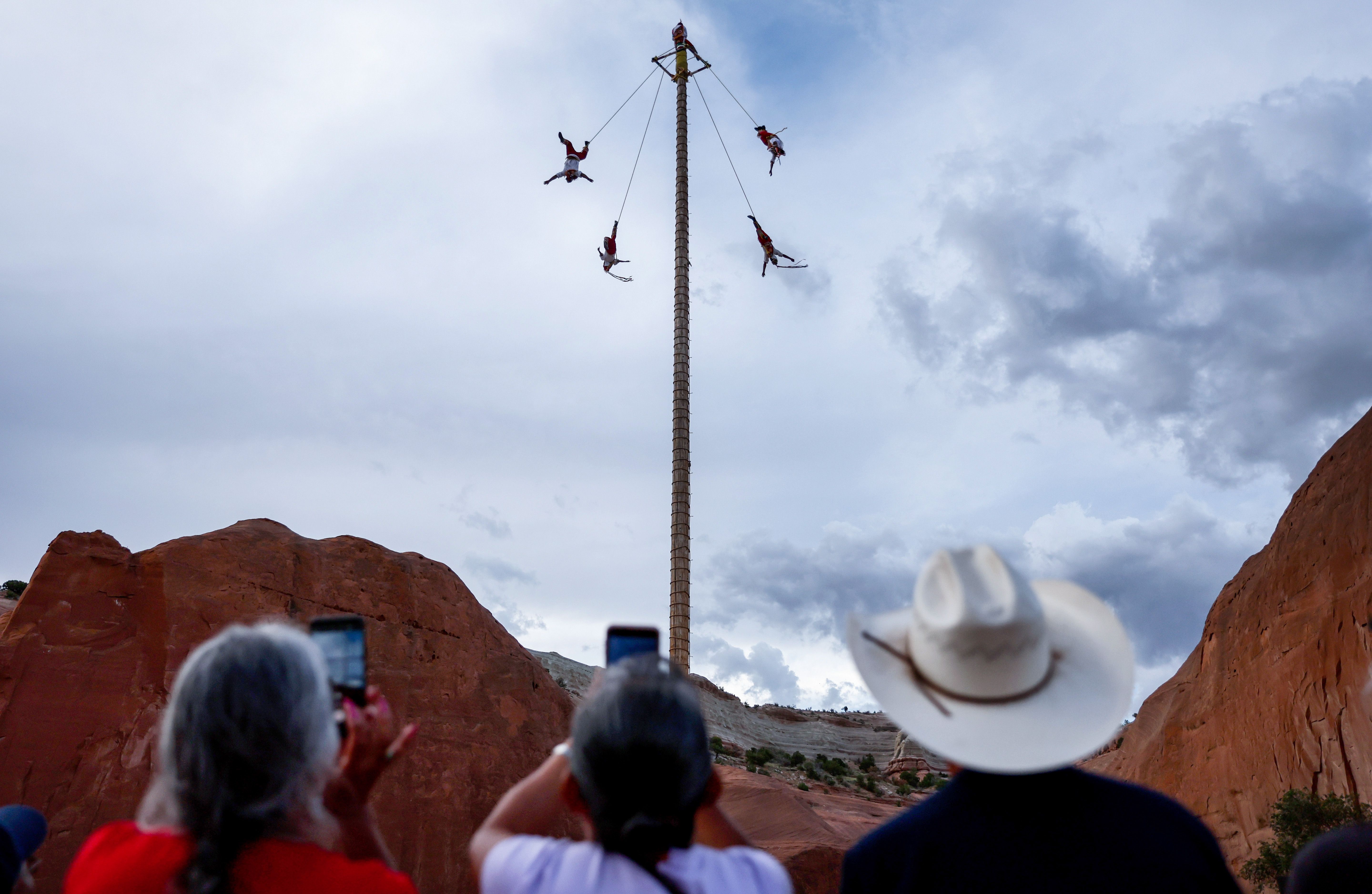Traditional dancers from Mexico and the U.S. perform the Danza de los Voladores (Dance of the Flyers) at the 100th Gallup Inter-Tribal Indian Ceremonial at Red Rock Park  near Gallup, New Mexico.