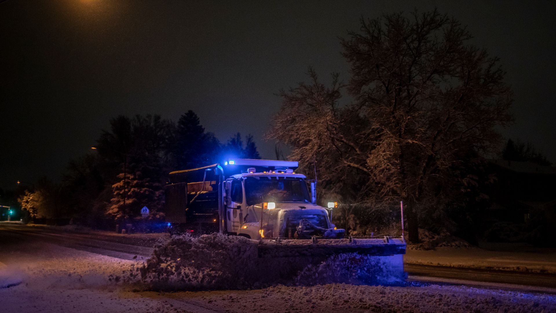 A snowplow clears streets of heavy snow during a winter storm in Boulder in March 2021. Photo: Chet Strange/Bloomberg via Getty Images