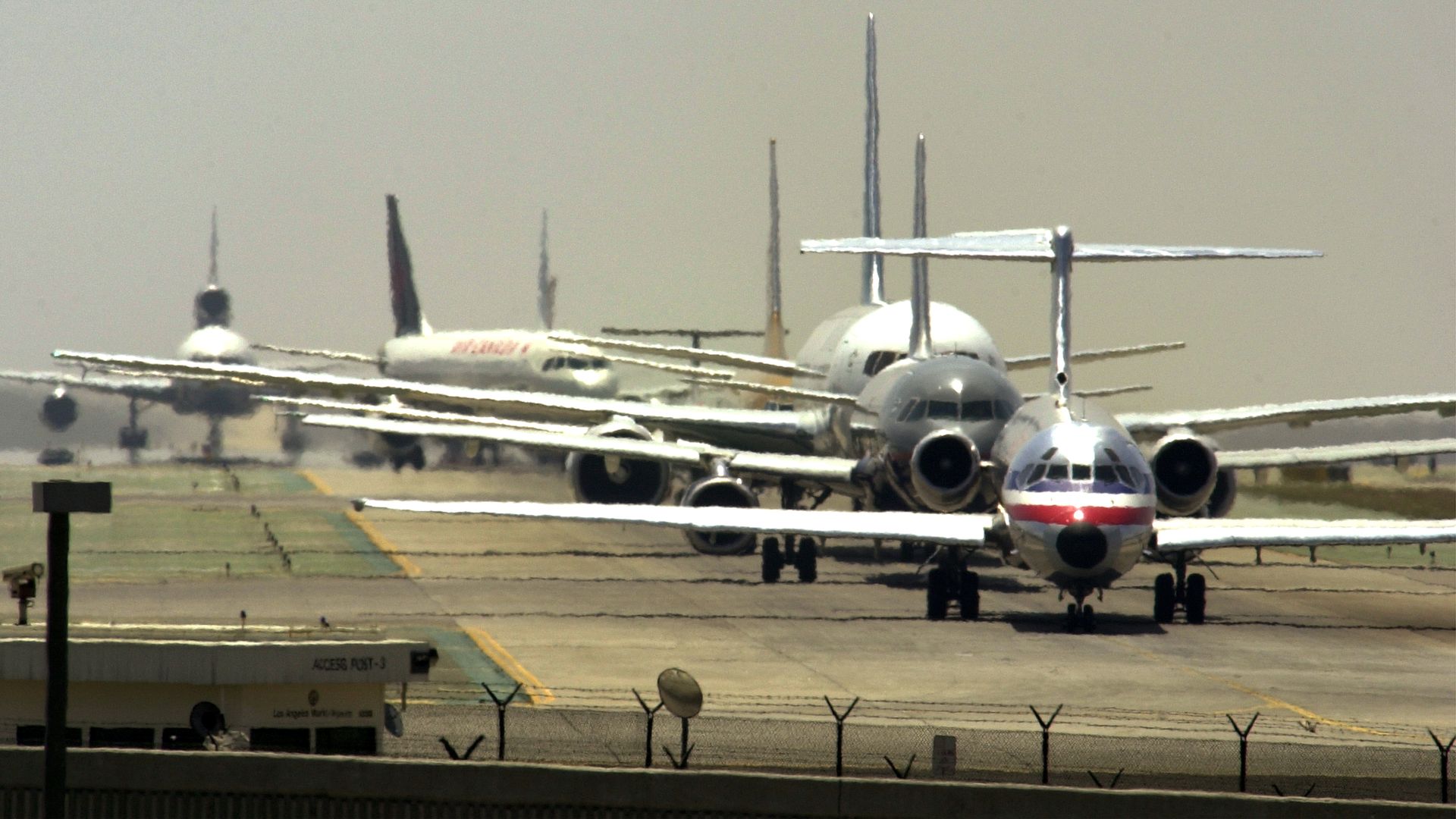 Photo of planes lined up on a runway