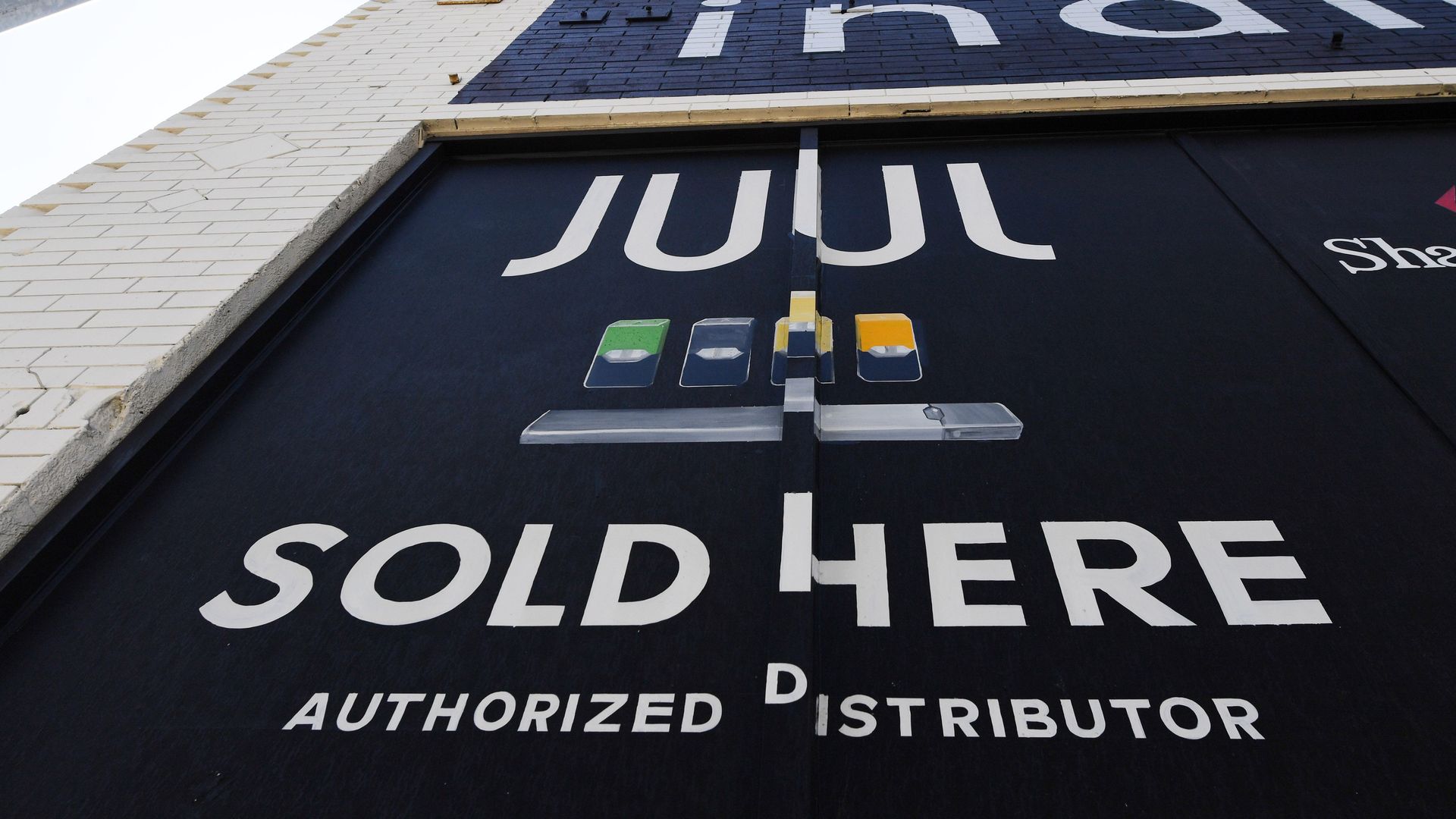 A sign advertising Juul vaping products.