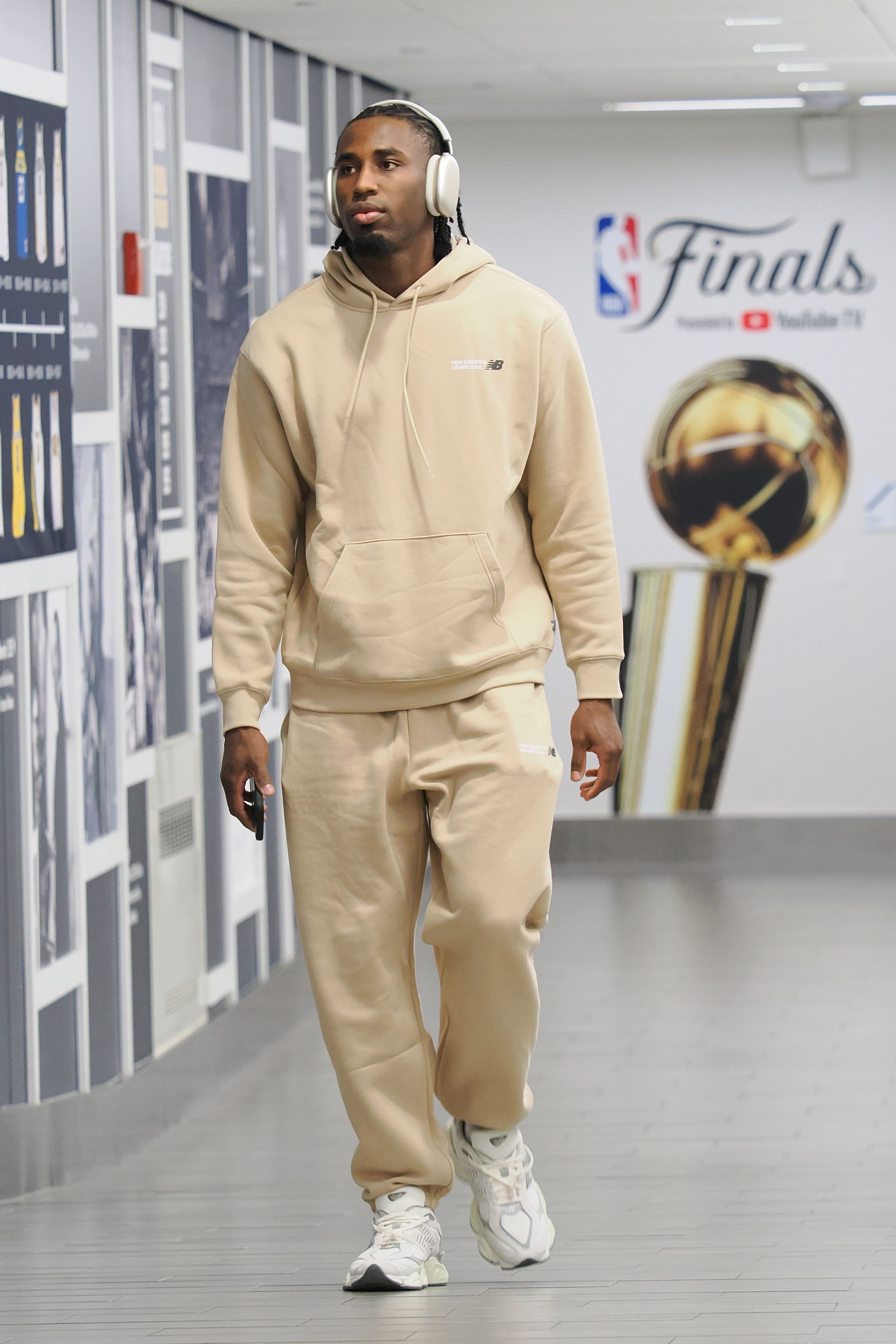 A man in a tan sweatsuit