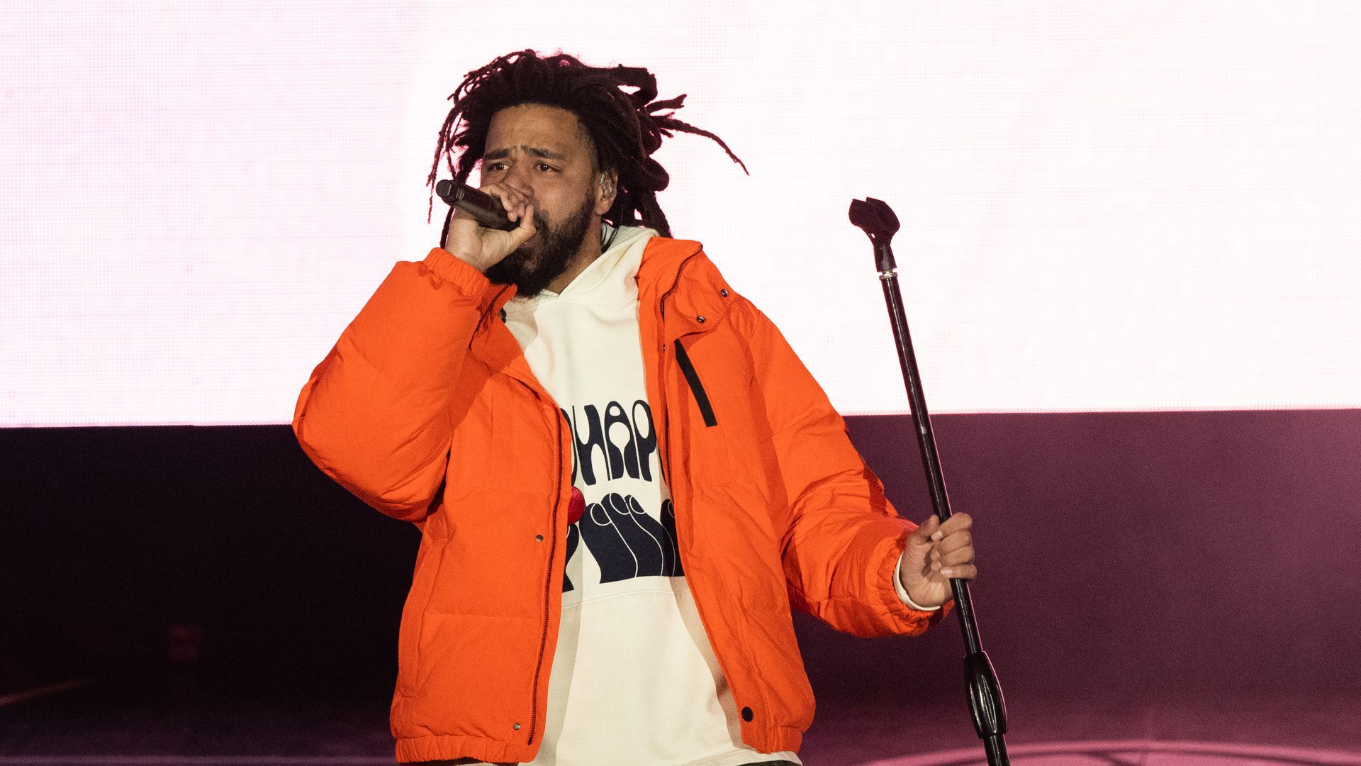 Rapper J. Cole performs onstage in 2021. 