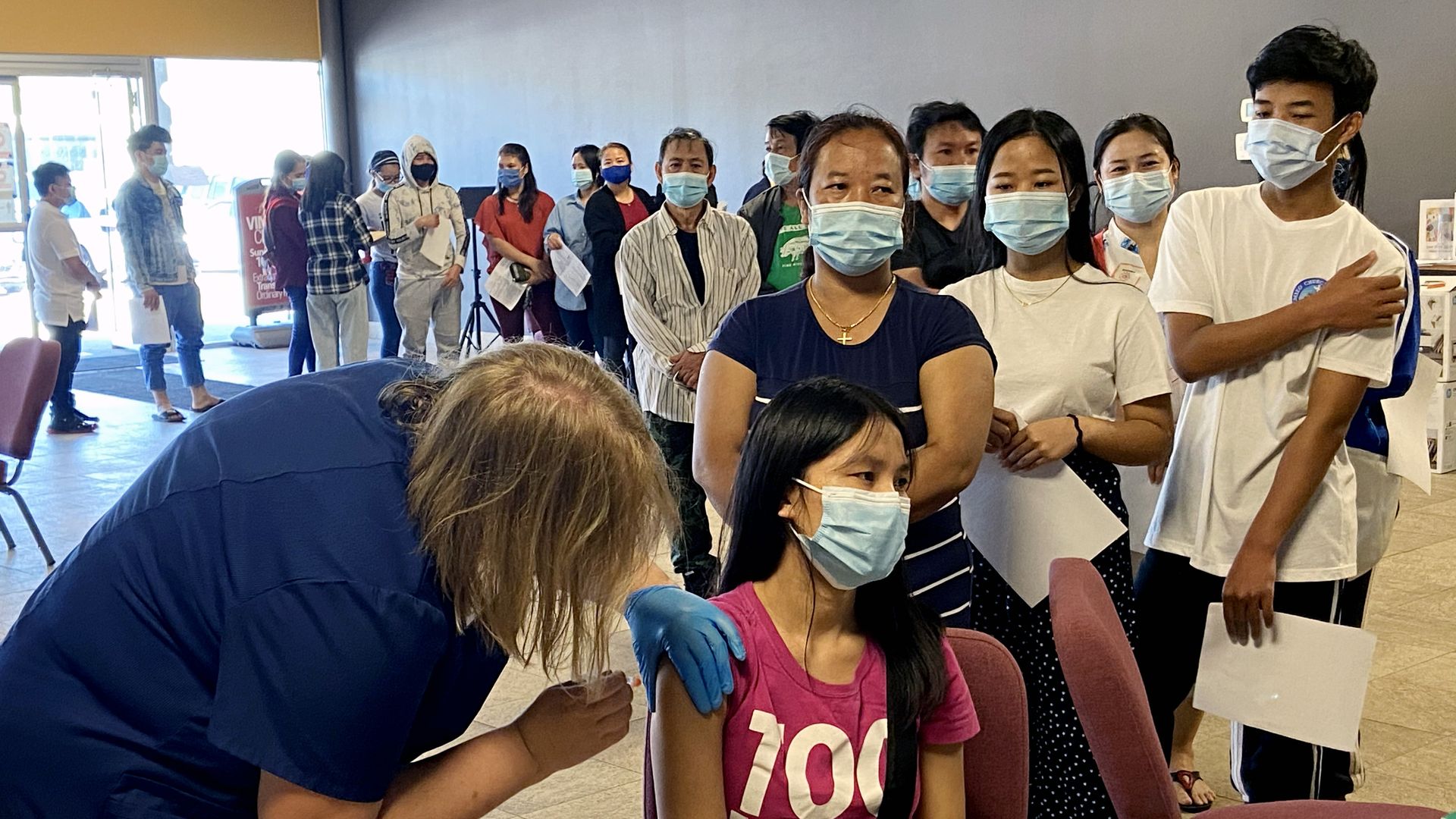 Refugees get vaccinated at an EMBARC clinic