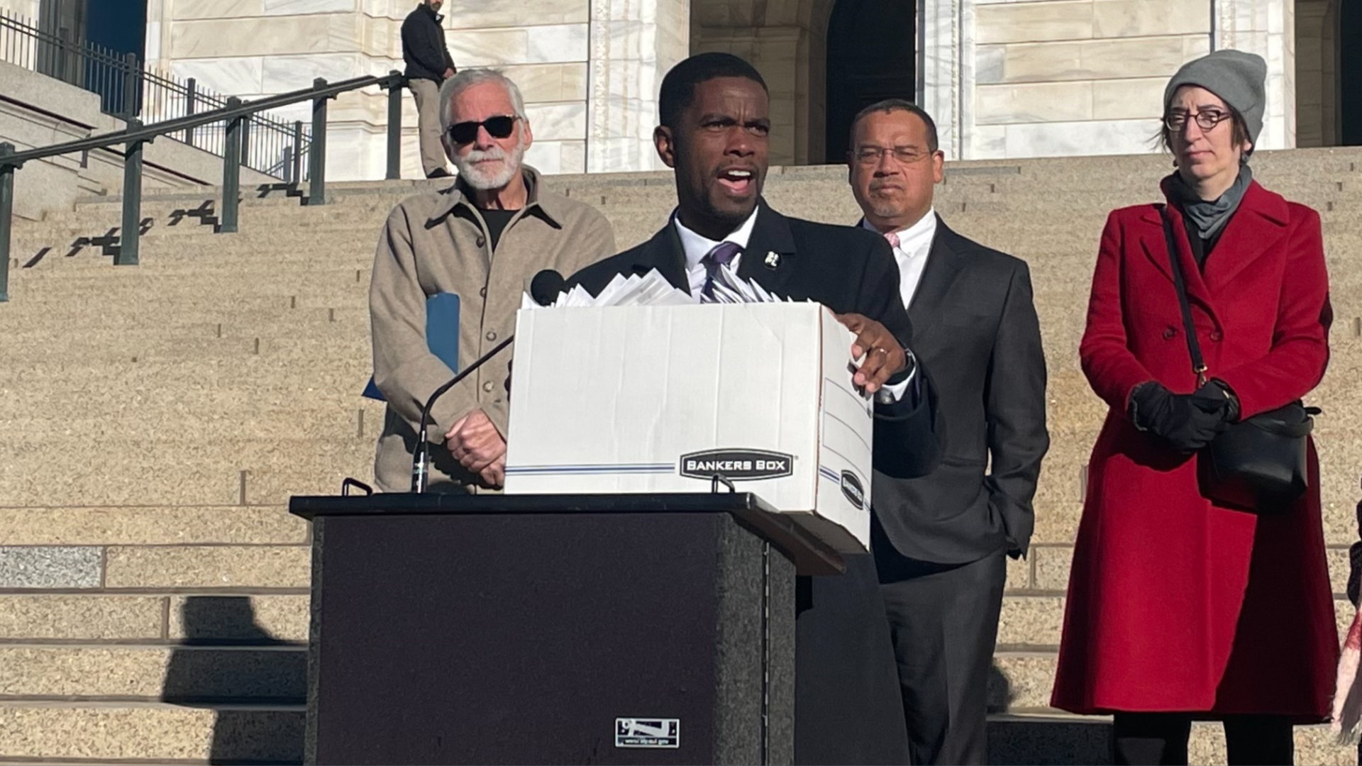 Mayor carterat a podium with a box of letters