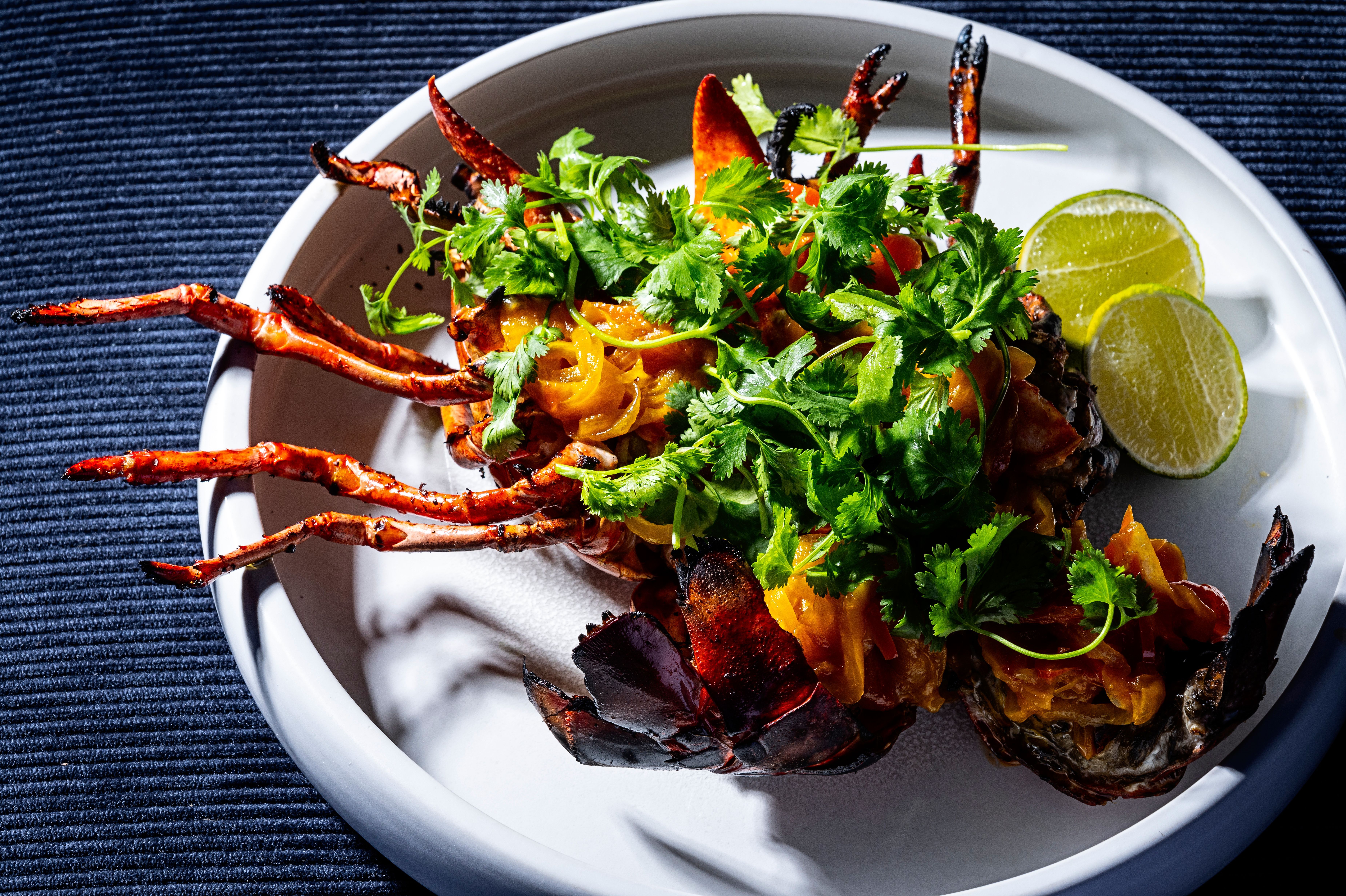 Grilled lobster topped with herbs