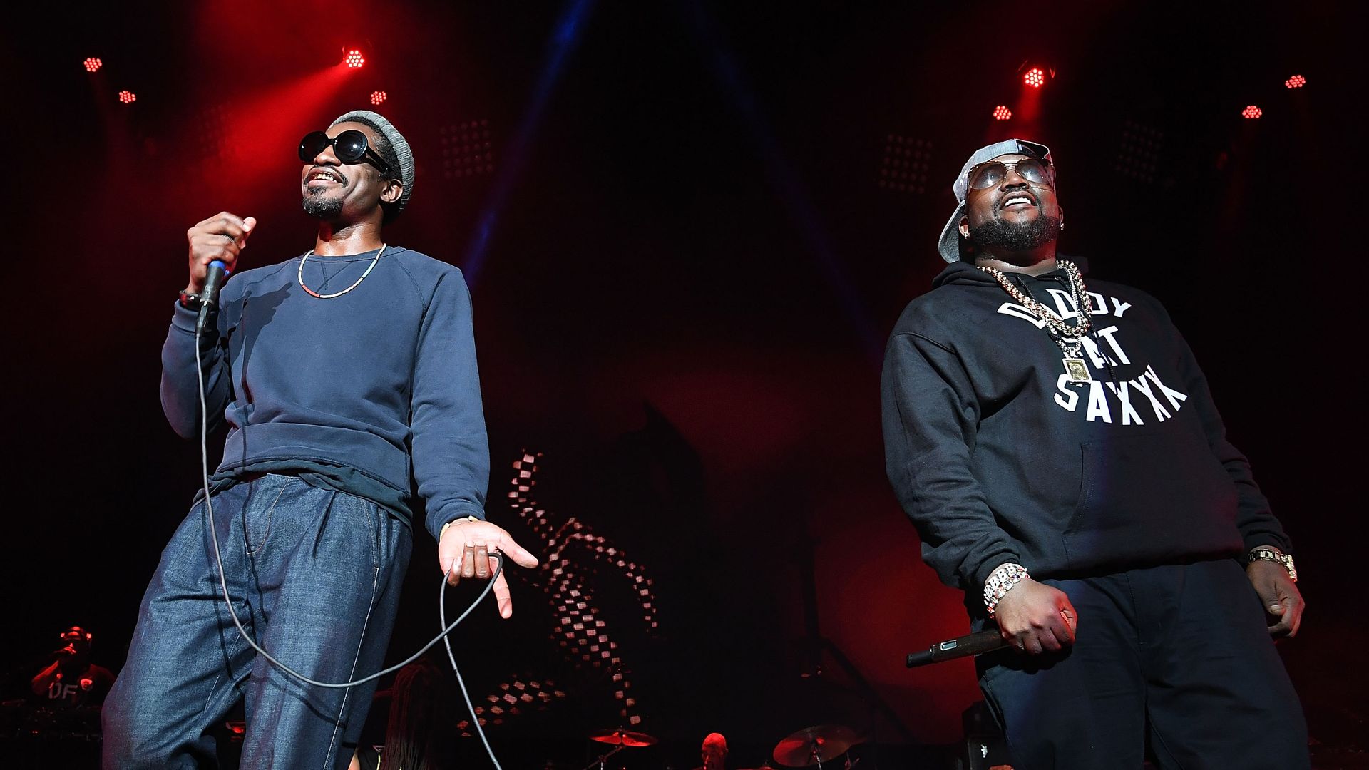 Andre 300 and Big Boi of Outkast perform on stage. 