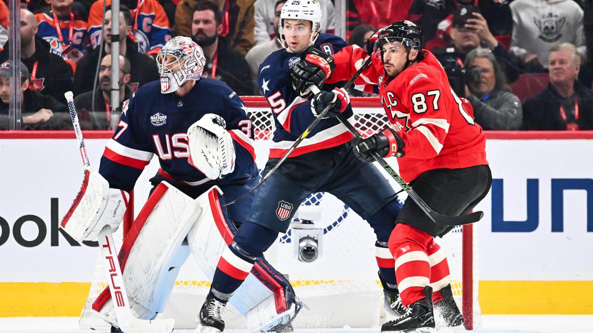 Charlie McAvoy of Team USA and Sidney Crosby of Team Canada battle for position during the third period in the 2025 NHL 4 Nations Face-Off at the Bell Centre on February 15, 2025 in Montreal, Canada. Team USA defeated Team Canada 3-1.