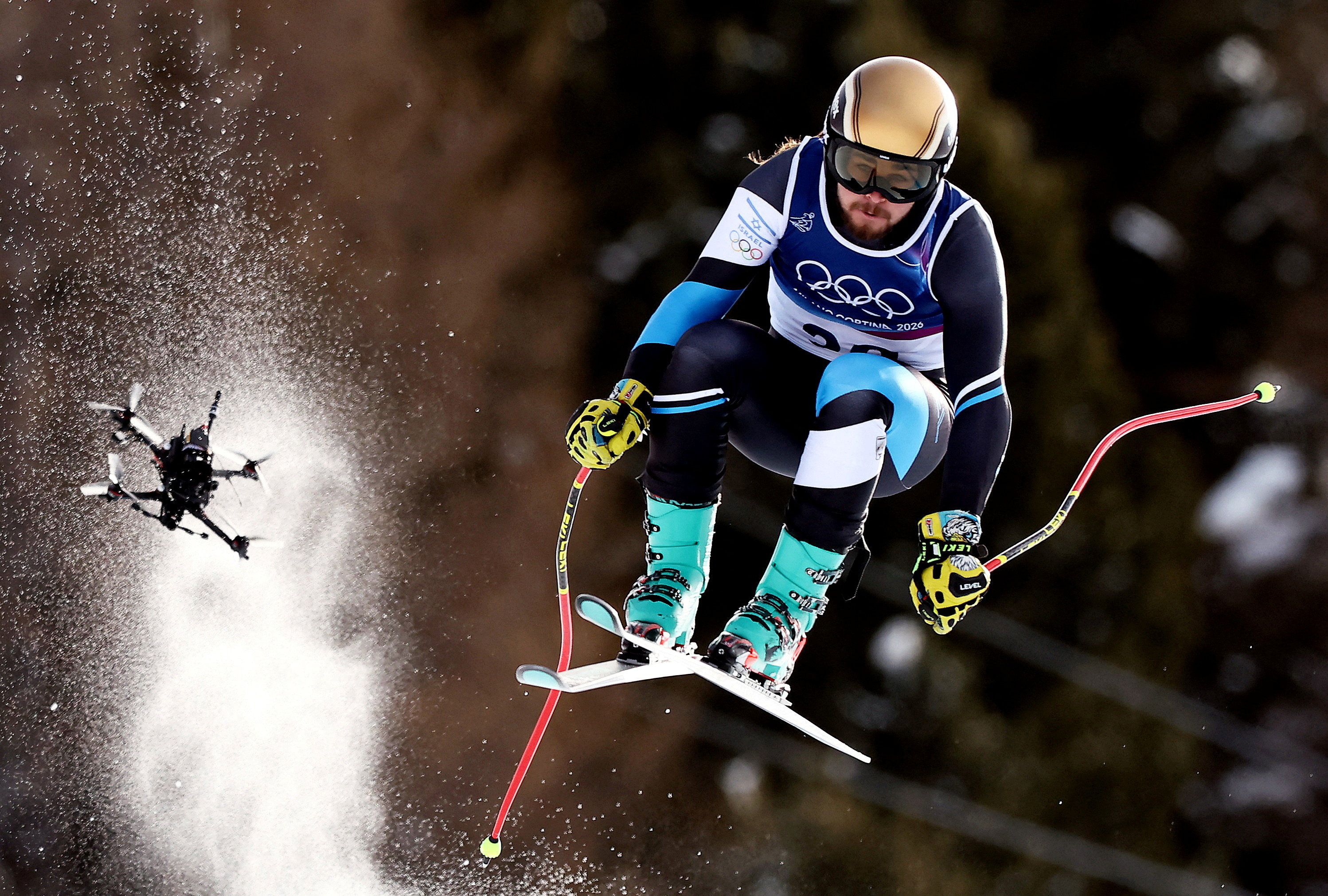 A drone follows downhill skier Barnabas Szollos of Israel during a run in Bormio, Italy, on Saturday.