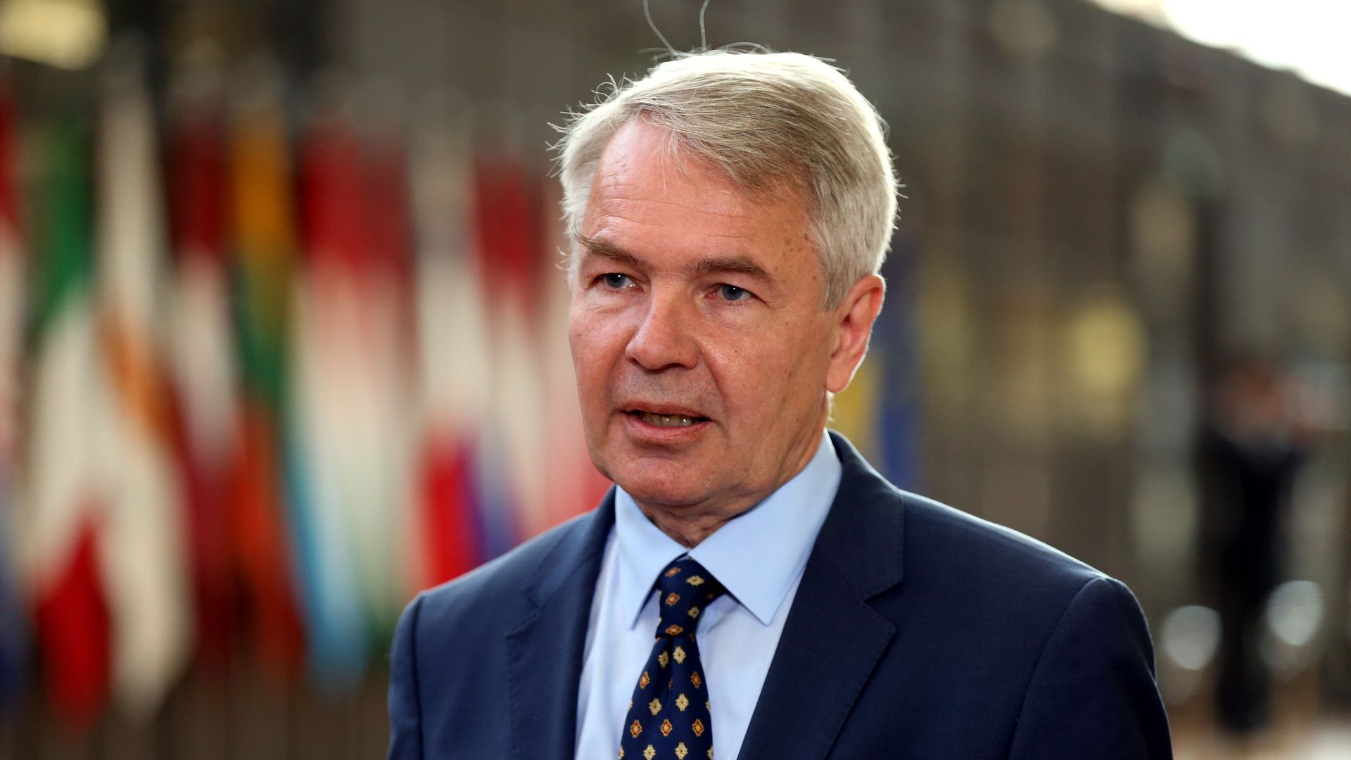Image of  Pekka Haavisto speaking to the press. 