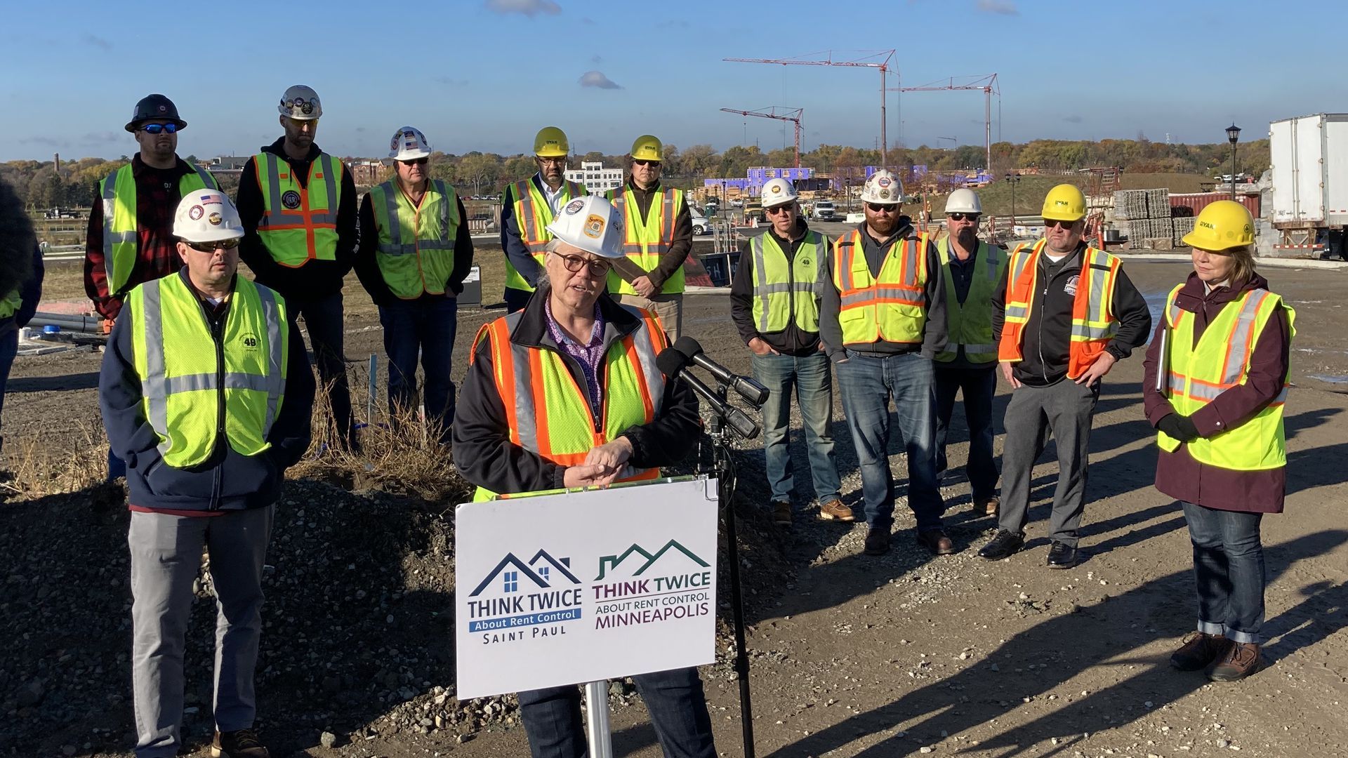 Construction workers and business leaders speaking against the rent control ballot question at St. Paul's Highland Bridge site.