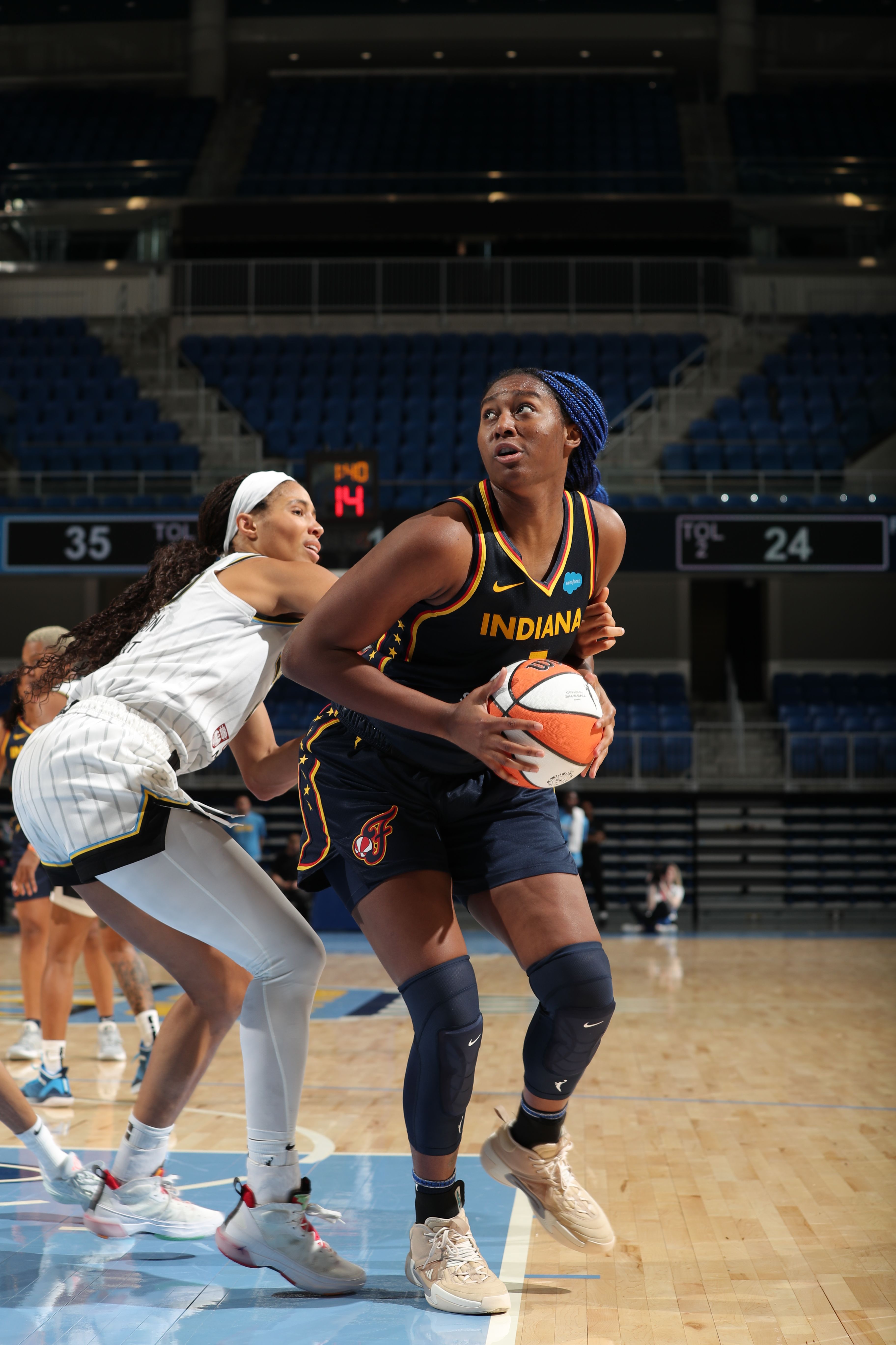 Aliyah Boston #7 of the Indiana Fever handles the ball during the preseason game 