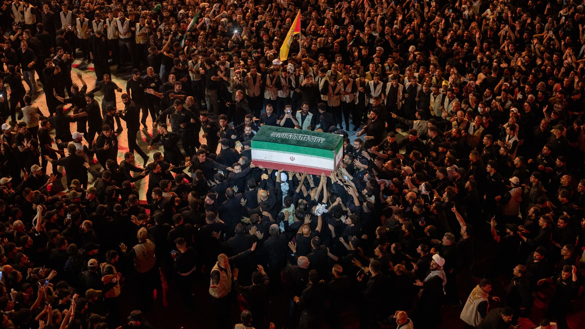 Mourners touch the coffin of Iran's Ayatollah Ali Khamenei during this week's funeral procession in Karbala, Iraq. Photo: Elke Scholiers/Getty Images