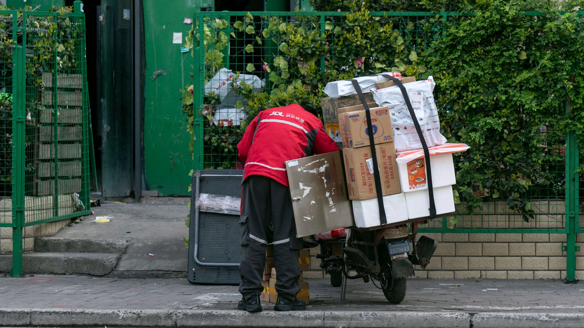 Worker with e-commerce parcels