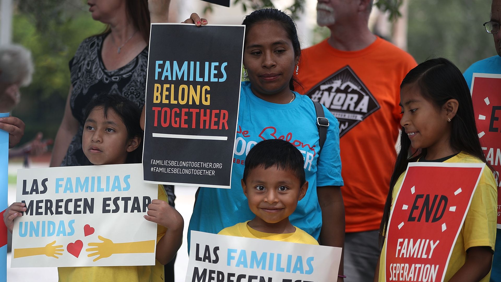 Protesters join together during a rally in front of the Miramar ICE detention facility on the National Day of Action for Children on June 1, 2018 in Miramar, Florida.