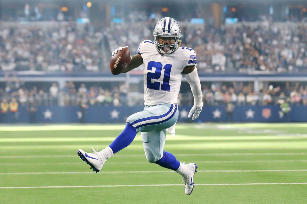 Ezekiel Elliott #21 of the Dallas Cowboys runs the ball for a touchdown during the third quarter against the New York Giants at AT&T Stadium on October 10, 2021 in Arlington, Texas. 