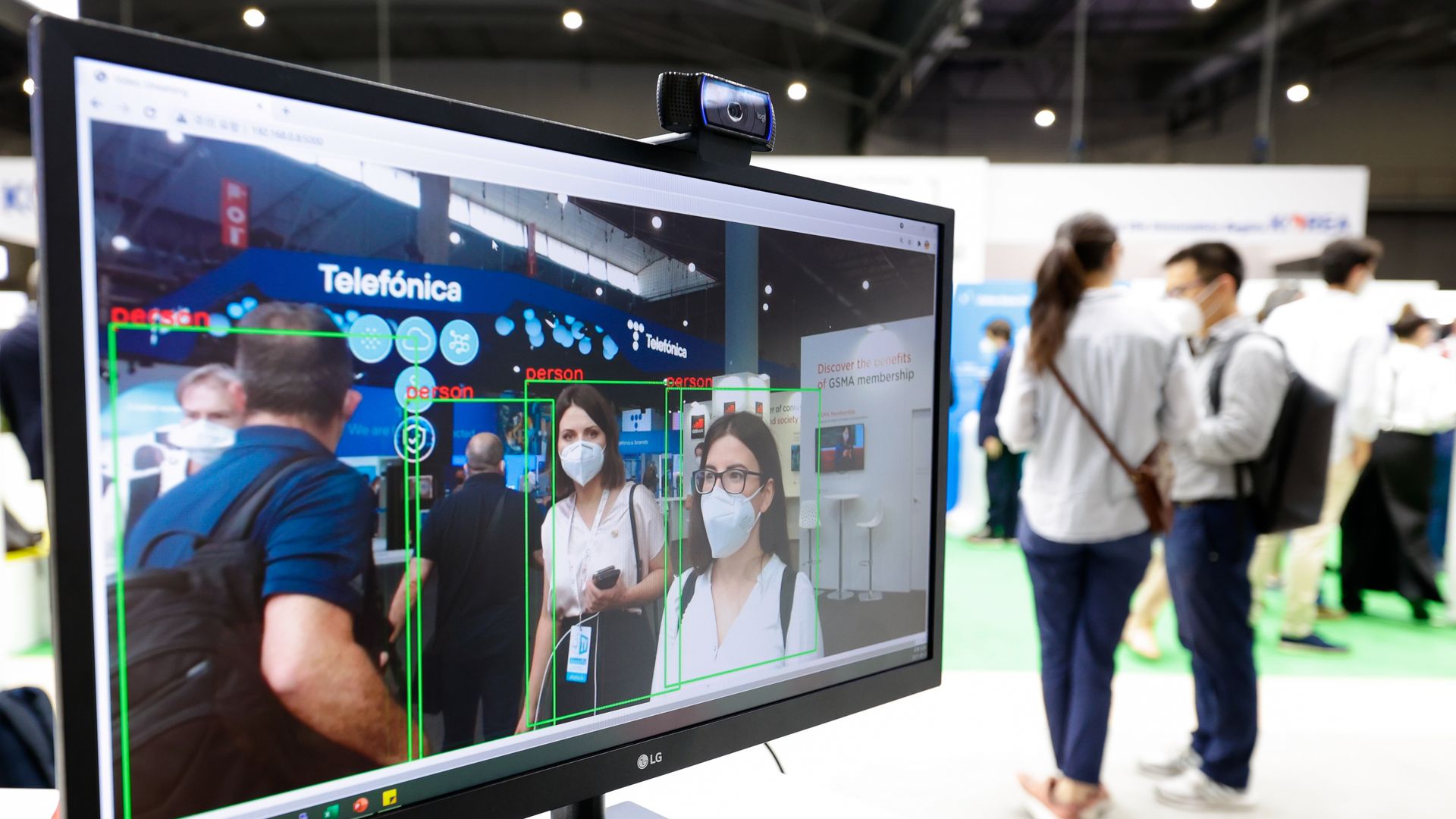 A computer using facial recognition showing people being recognized