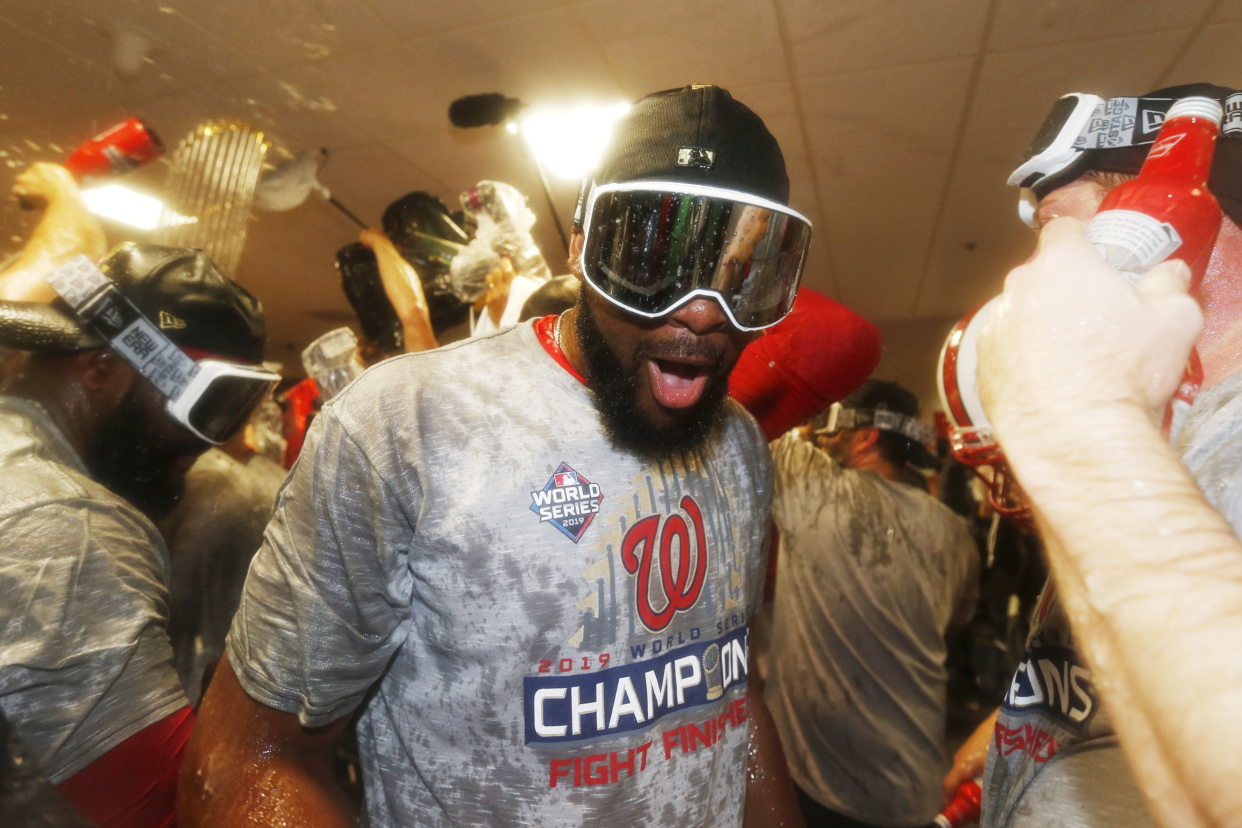 Howie Kendrick #47 of the Washington Nationals celebrates in the locker room