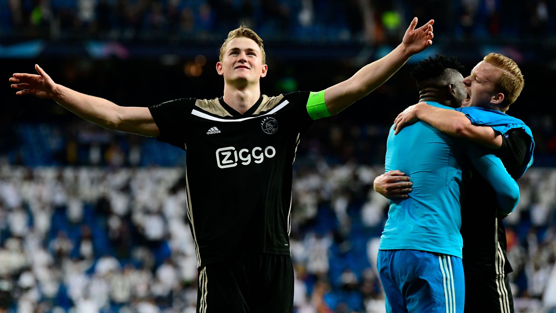 Ajax players celebrate after the game