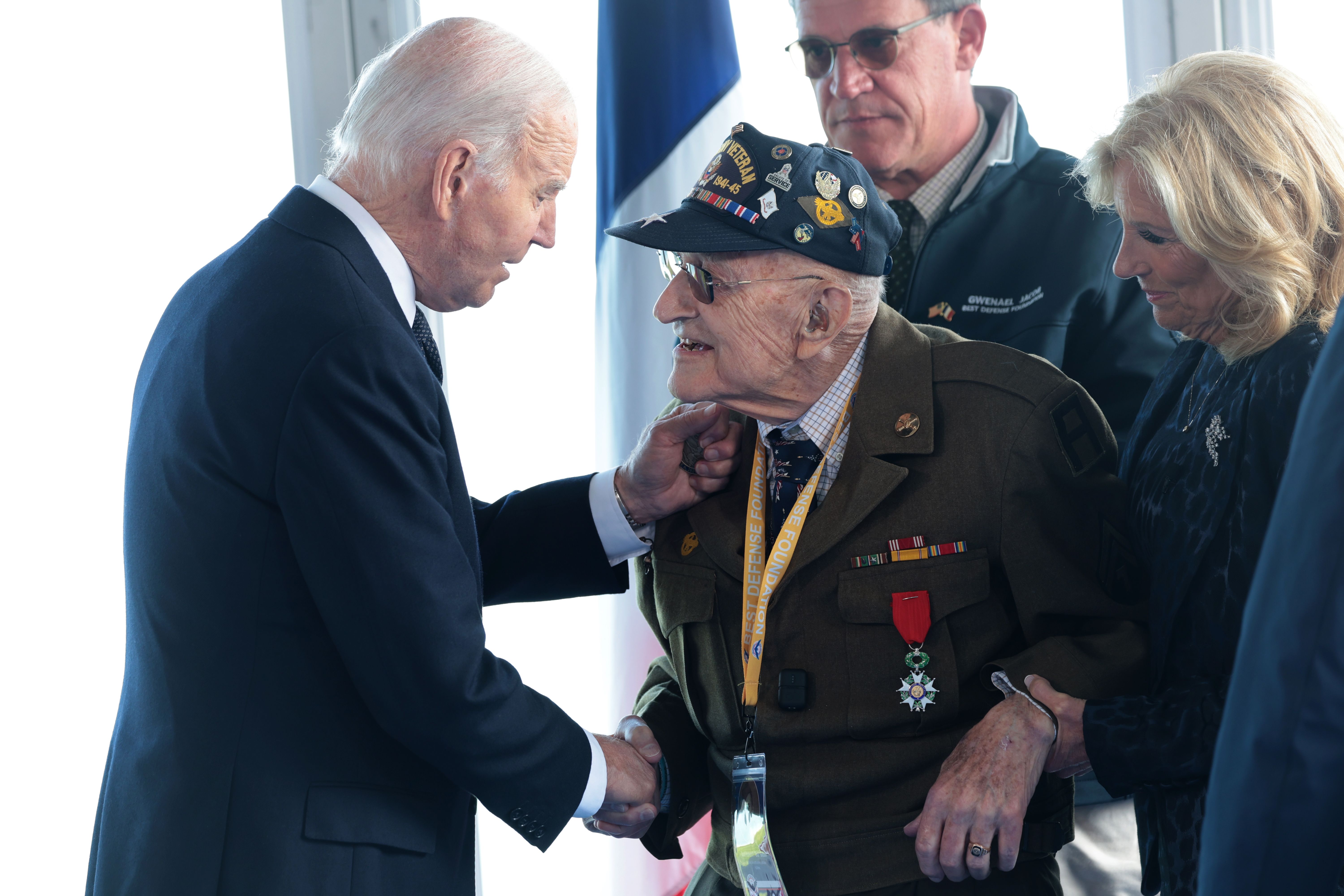 President Biden and first lady Jill Biden greet U.S. World War II veterans on June 6, 2024, in Colleville-sur-Mer, France.
