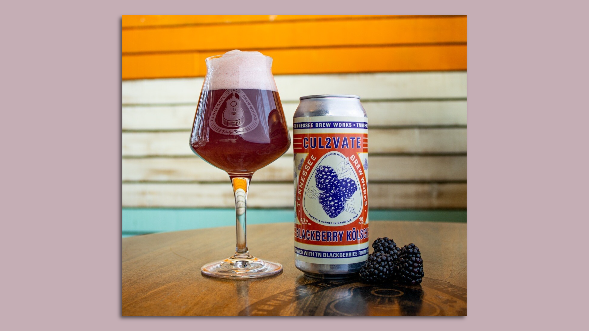 A glass of beer sitting next to a can.