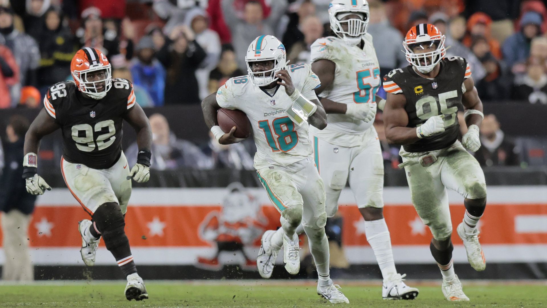 Miami Dolphins quarterback Tyler Huntley runs against the Cleveland Browns.