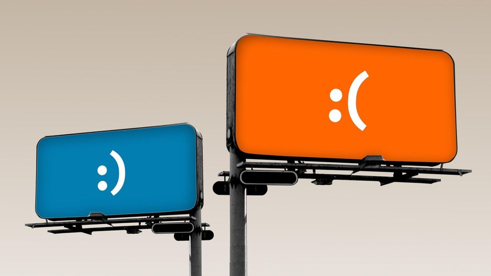 Billboards made of two phones; one with a frowny face, the other with a smiley face.