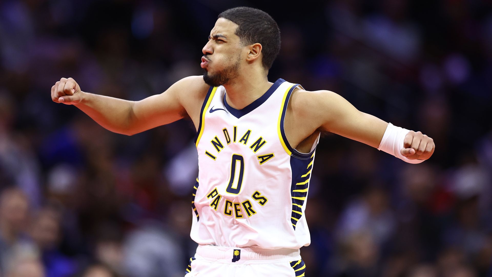 Pacers guard Tyrese Haliburton celebrates a play in a game against the Philadelphia 76ers.