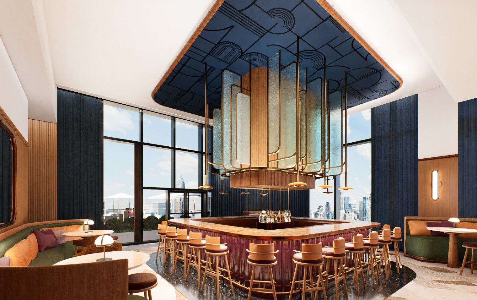 Contemporary hotel bar with a circular central wooden bar, gold-framed layered pendant lights, blue paneled walls, cozy booths, and floor-to-ceiling windows overlooking a city skyline.