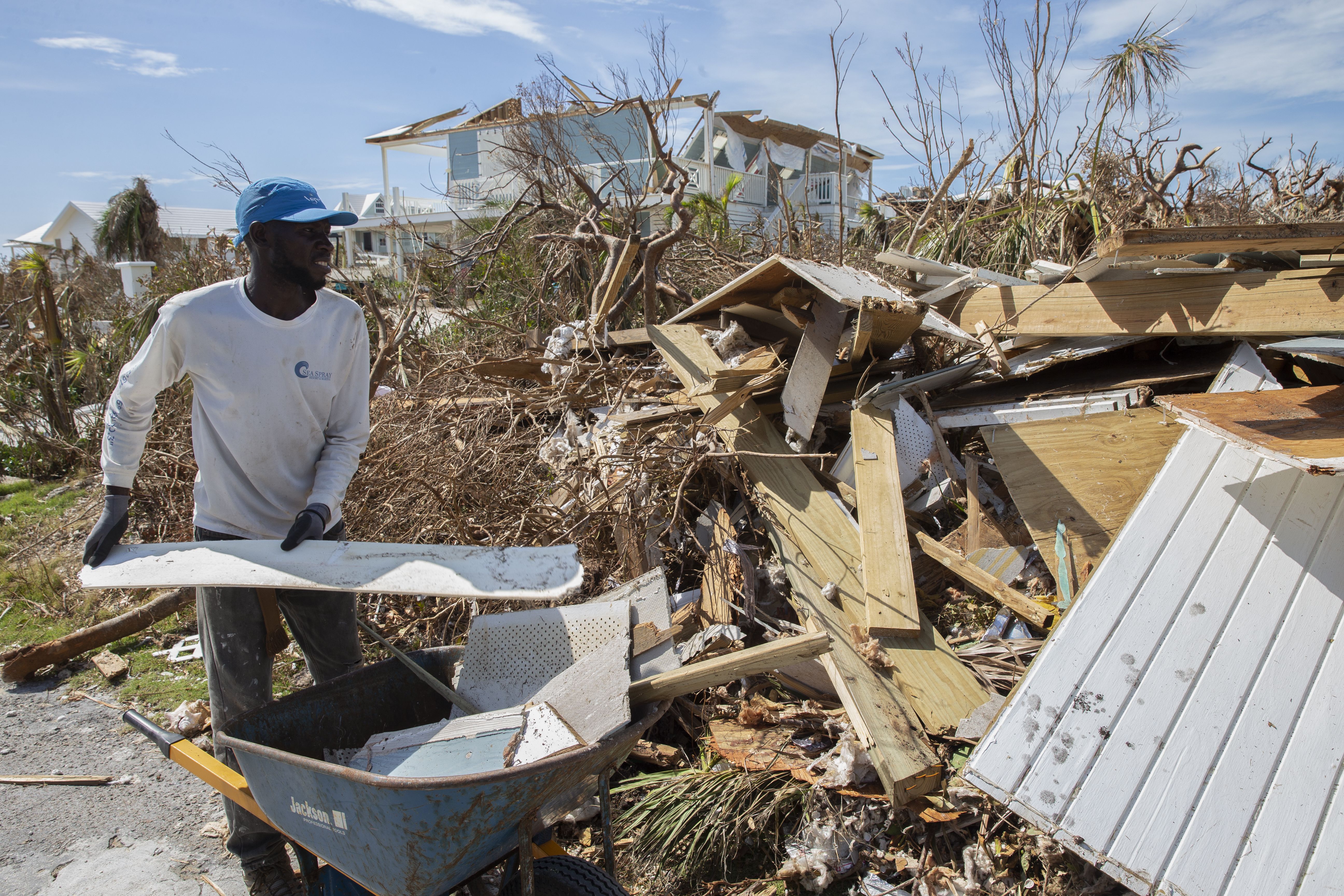 Eludieu Jnnoel collects rubble and debris from damaged homes after hurricane Dorian devastated Elbow Key Island on September 8, 2019 in Hope Town, Bahamas.