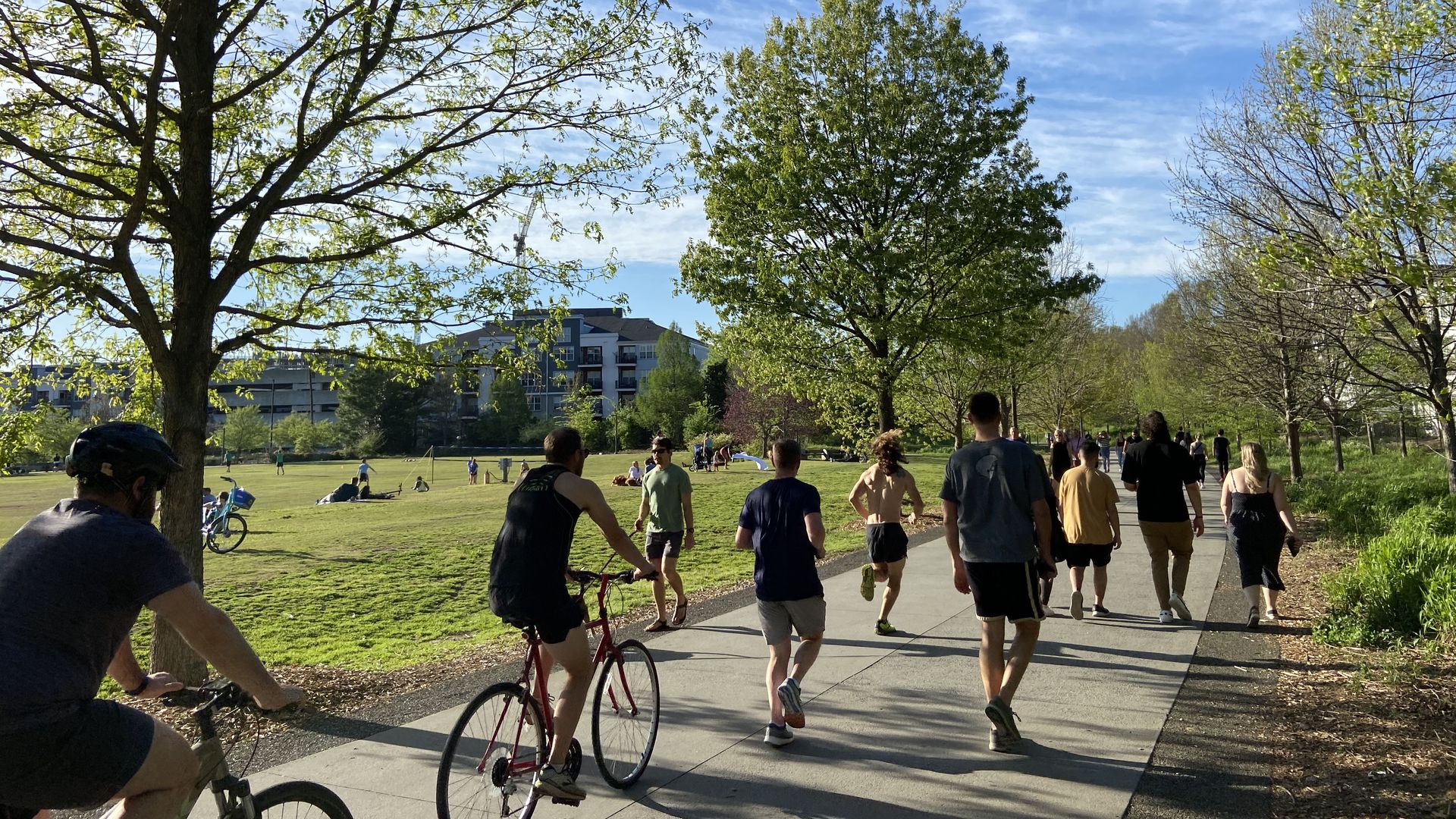 People ride bikes, jog, and walk on the Atlanta beltline Eastside trail
