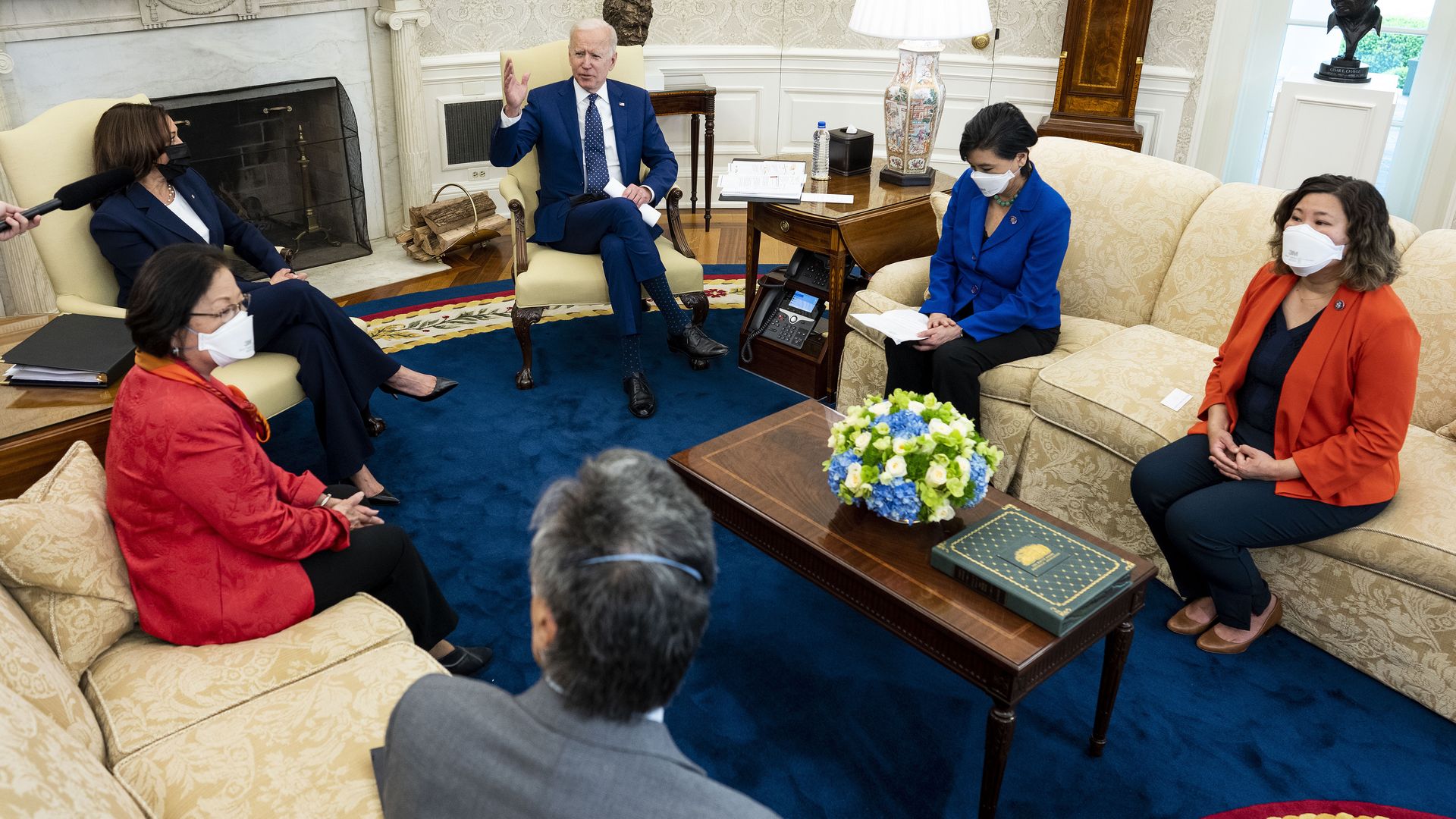 Picture of President Biden and Vice President Harris sitting in the oval office alongside Asian lawmakers