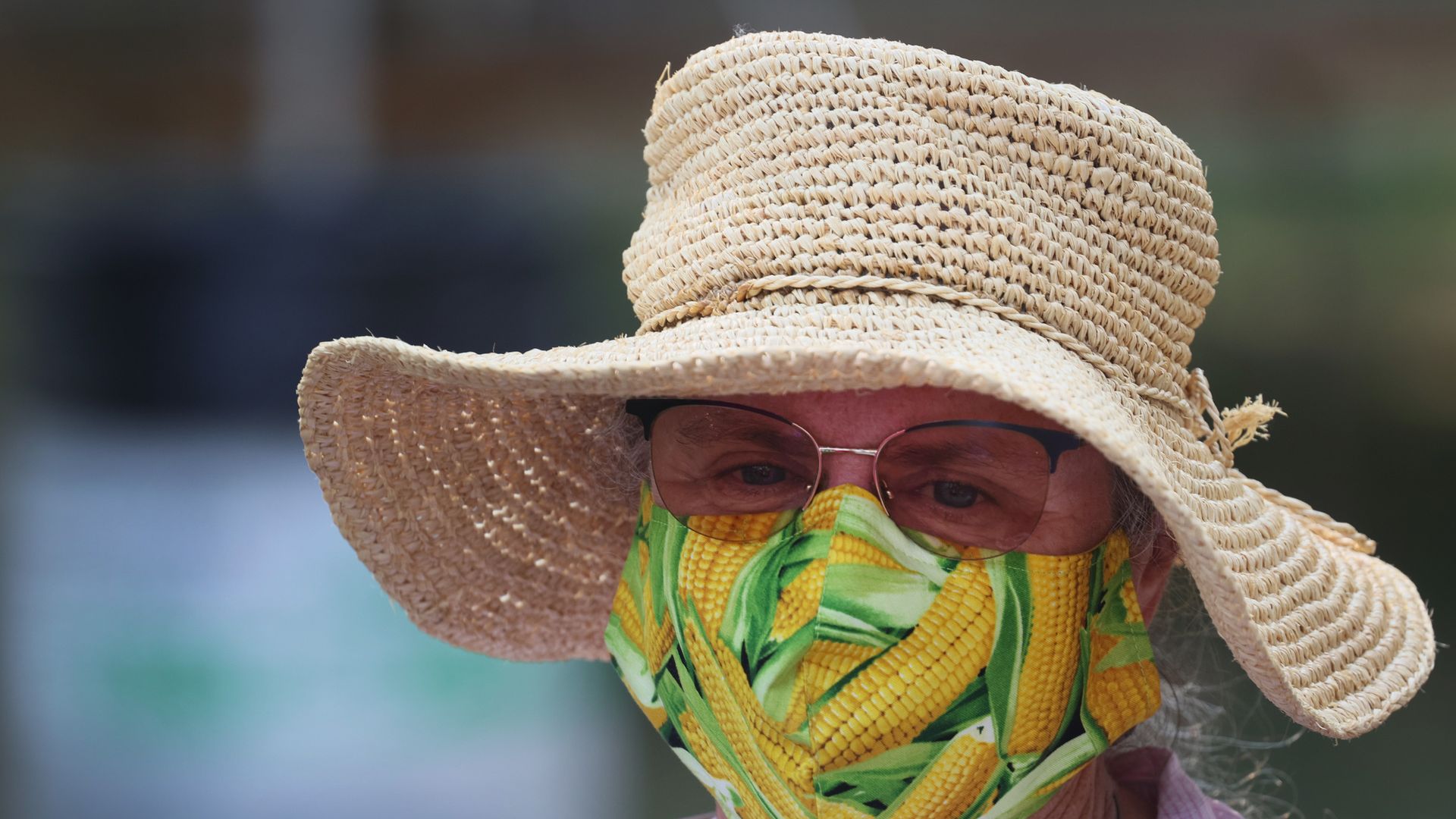 A photo of a woman wearing a facemask.