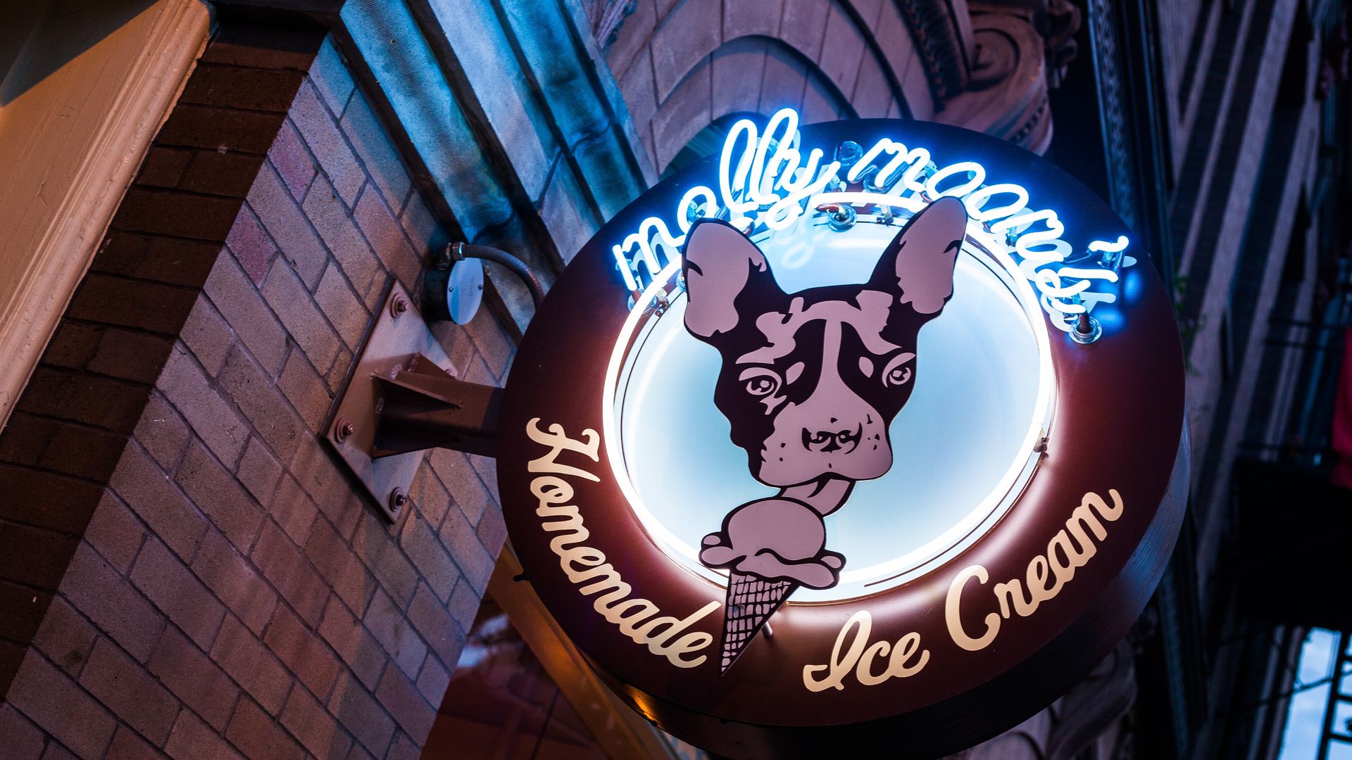 Molly Moon's neon sign is lighted up at night in Seattle. 