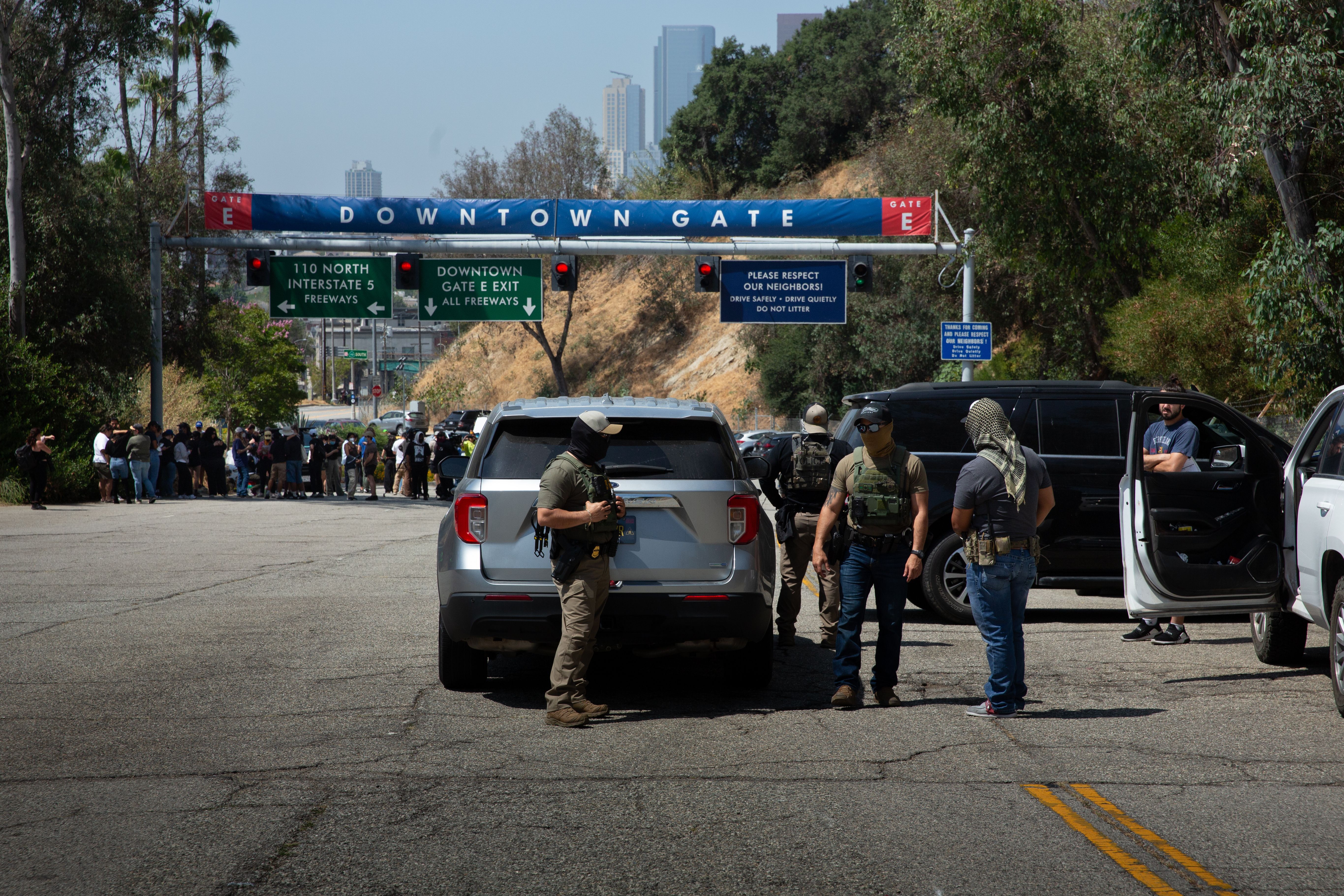20 June 2025, US, Los Angeles: Border Patrol agents stand at Gate E of Dodger Stadium in Los Angeles. The Dodgers denied them access, stating that immigration agents are not allowed on the property. The agents said no one was detained. Photo: Zin Chiang/dpa (Photo by Zin Chiang/picture alliance via 