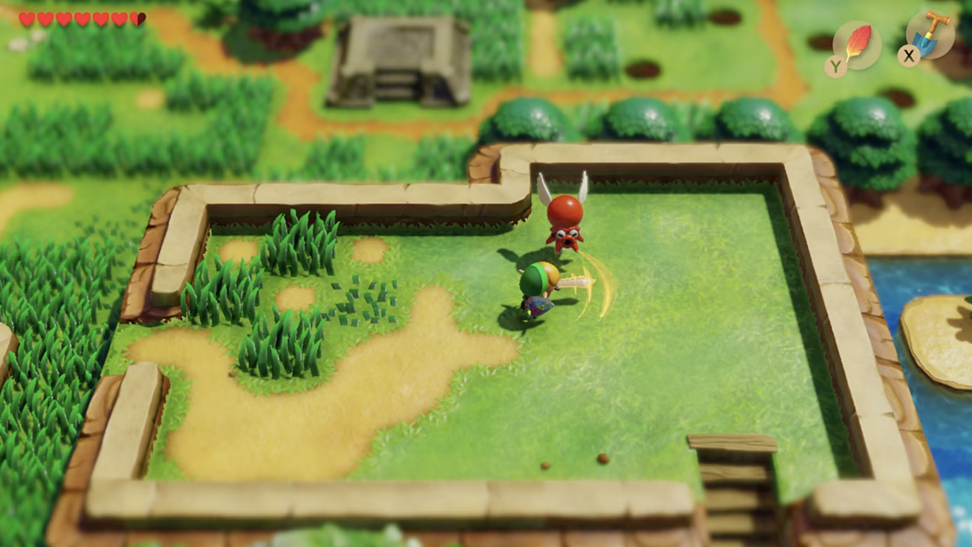 Video game screenshot of a warrior in green swinging a sword at a red creature