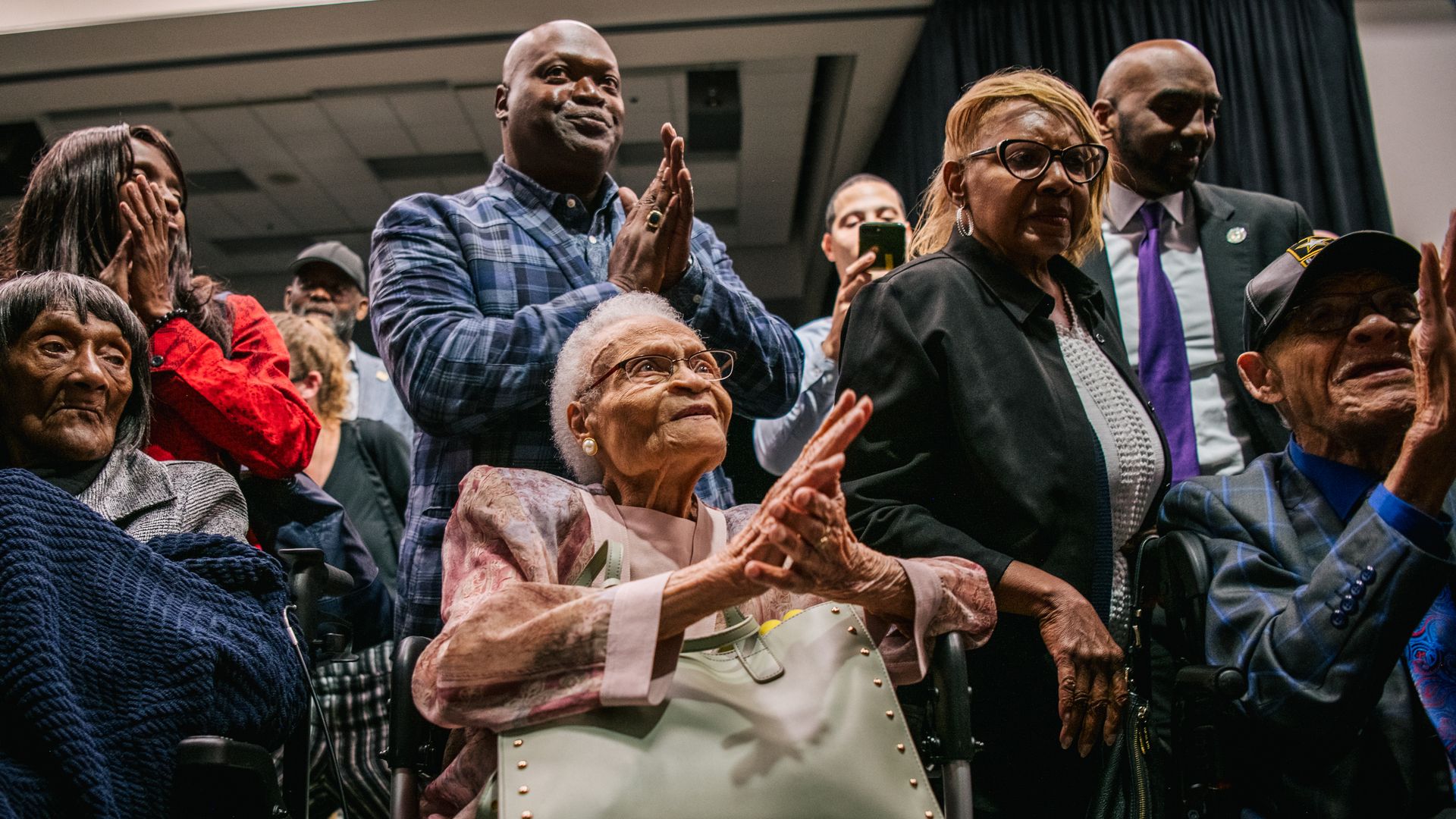 Tulsa Race Massacre survivors Lessie Benningfield Randle, Viola Fletcher, and Hughes Van Ellis sing together at the conclusion of a rally during commemorations of the 100th anniversary of the Tulsa Race Massacre on June 01, 2021 in Tulsa, Oklahoma.