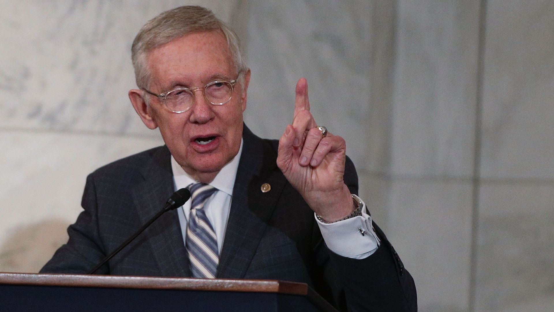 Harry Reid talking at a podium.
