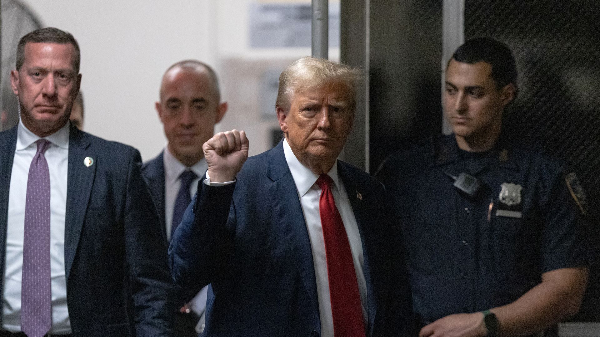 Former U.S. President Donald Trump returns from a break in his criminal trial for allegedly covering up hush money payments at Manhattan Criminal Court on April 25, 2024 in New York City. 