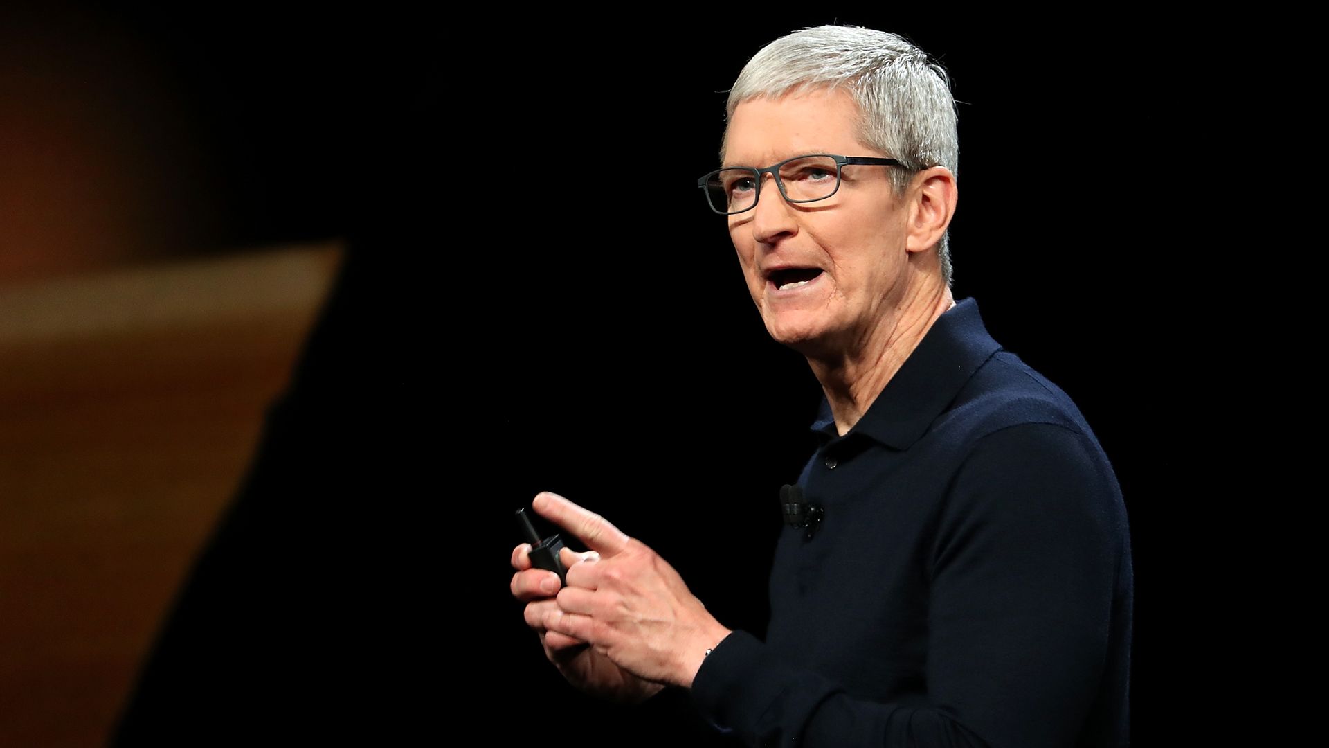 Tim Cook on stage at an event. 